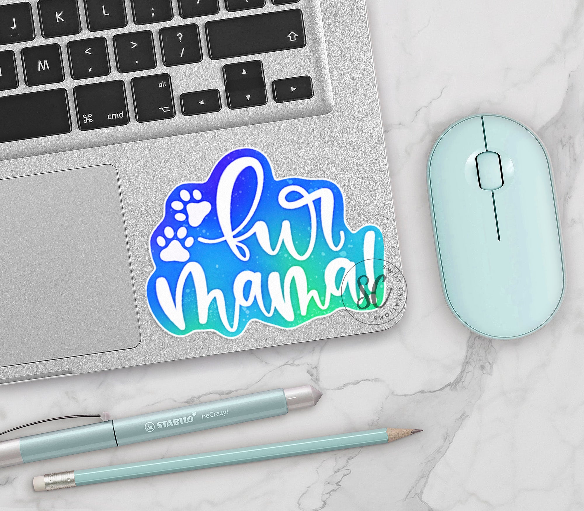 a laptop computer sitting next to a mouse and keyboard