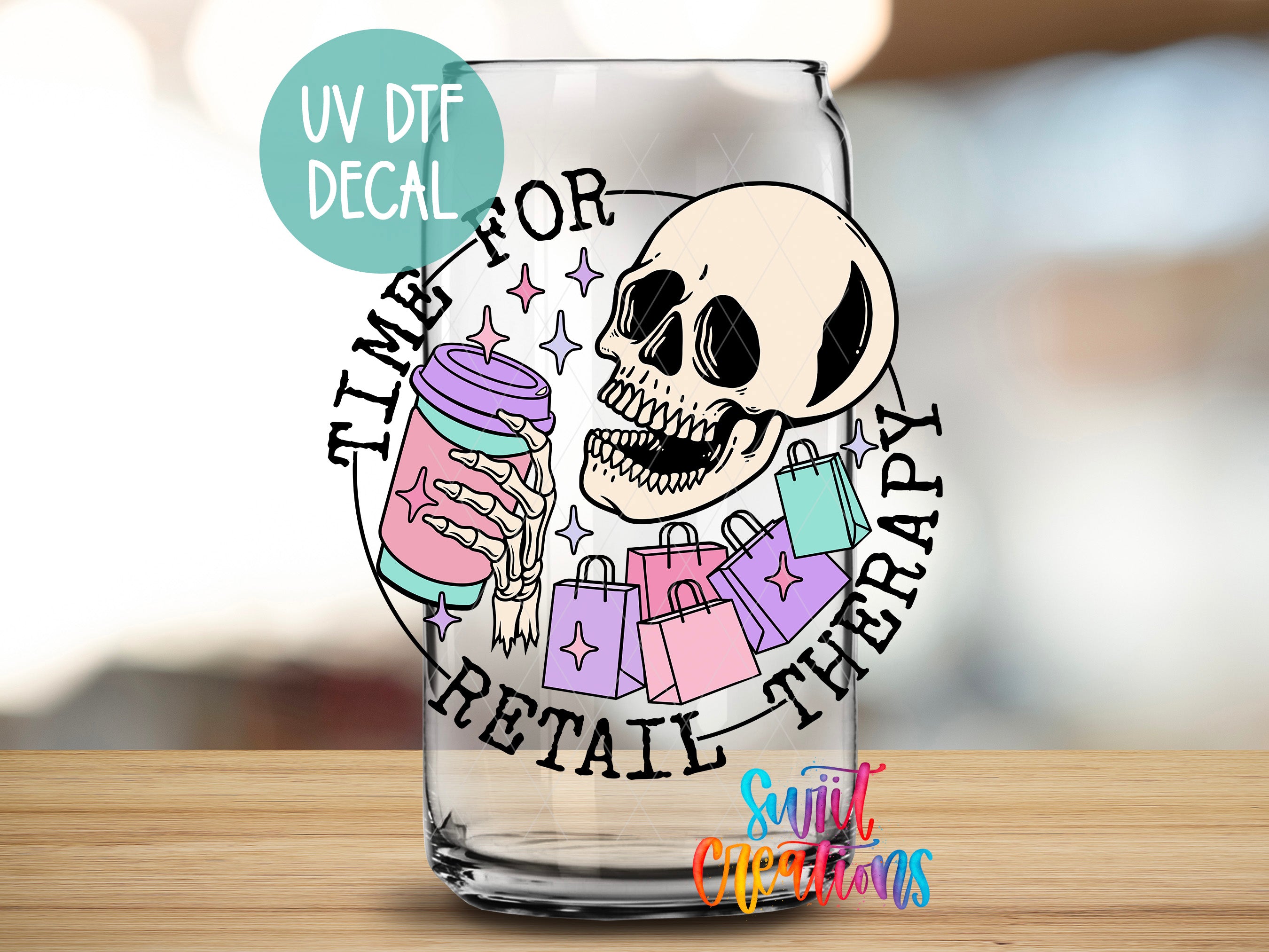 A glass with a skull and shopping bags, along with the text "Time for Retail Therapy" and "UV DFT DECAL".
