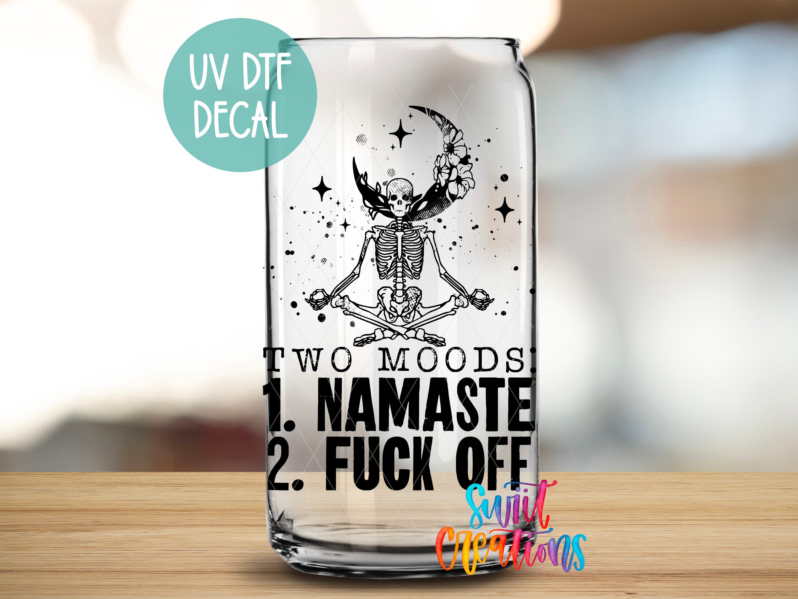 a glass with a picture of a skeleton on it