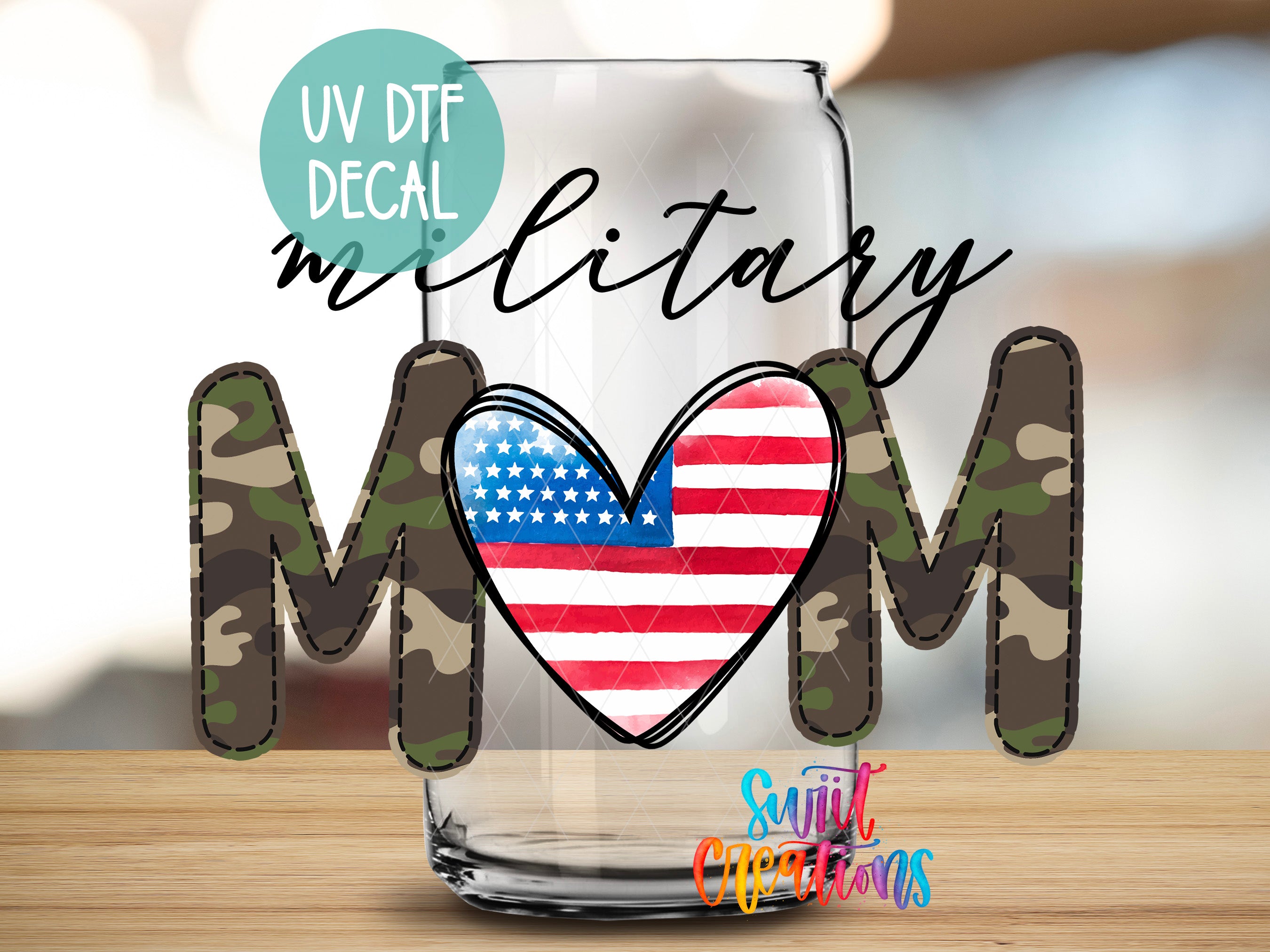 a glass with a military-themed design, including a heart shape and the letters "MOM" in camouflage pattern.