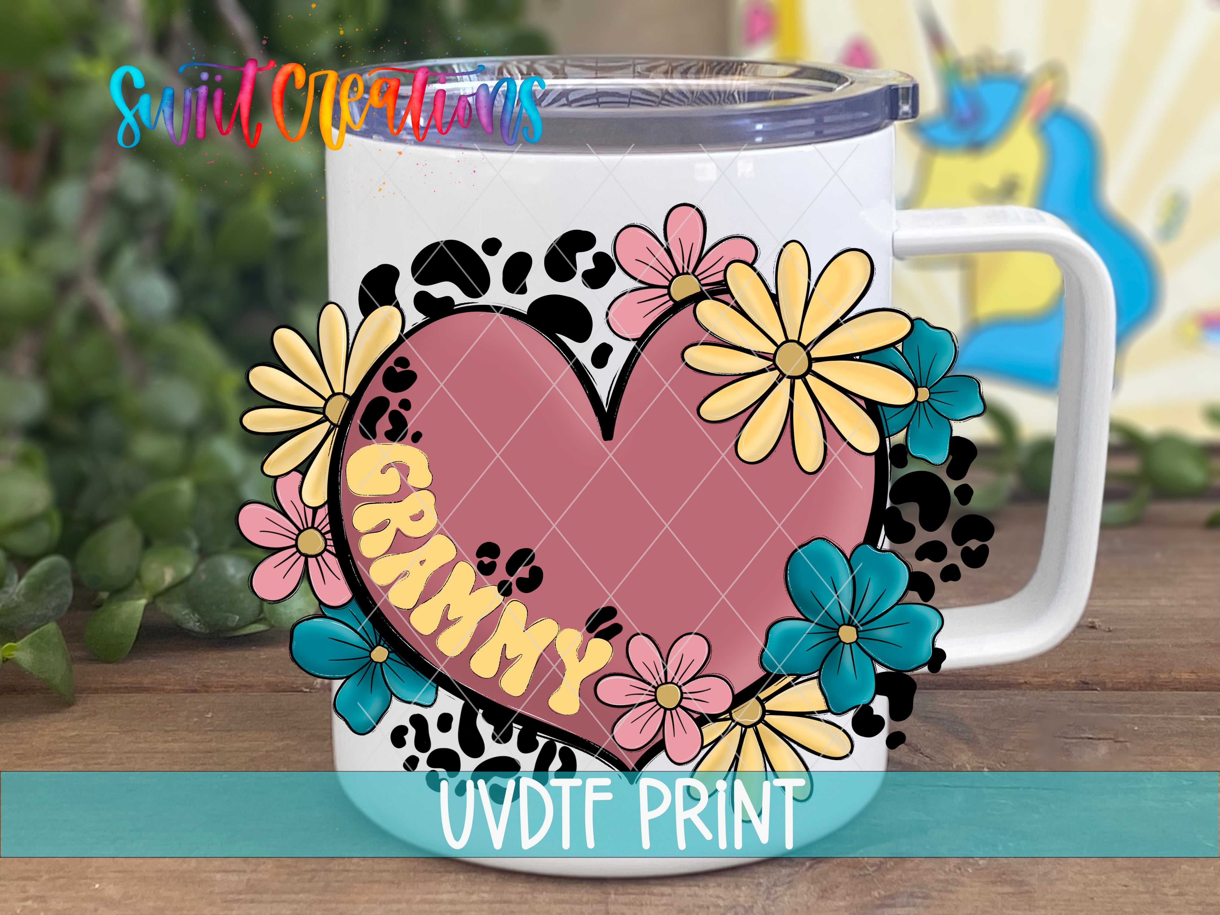 A white mug with a colorful floral design and the word "GRAMMY" printed on it.