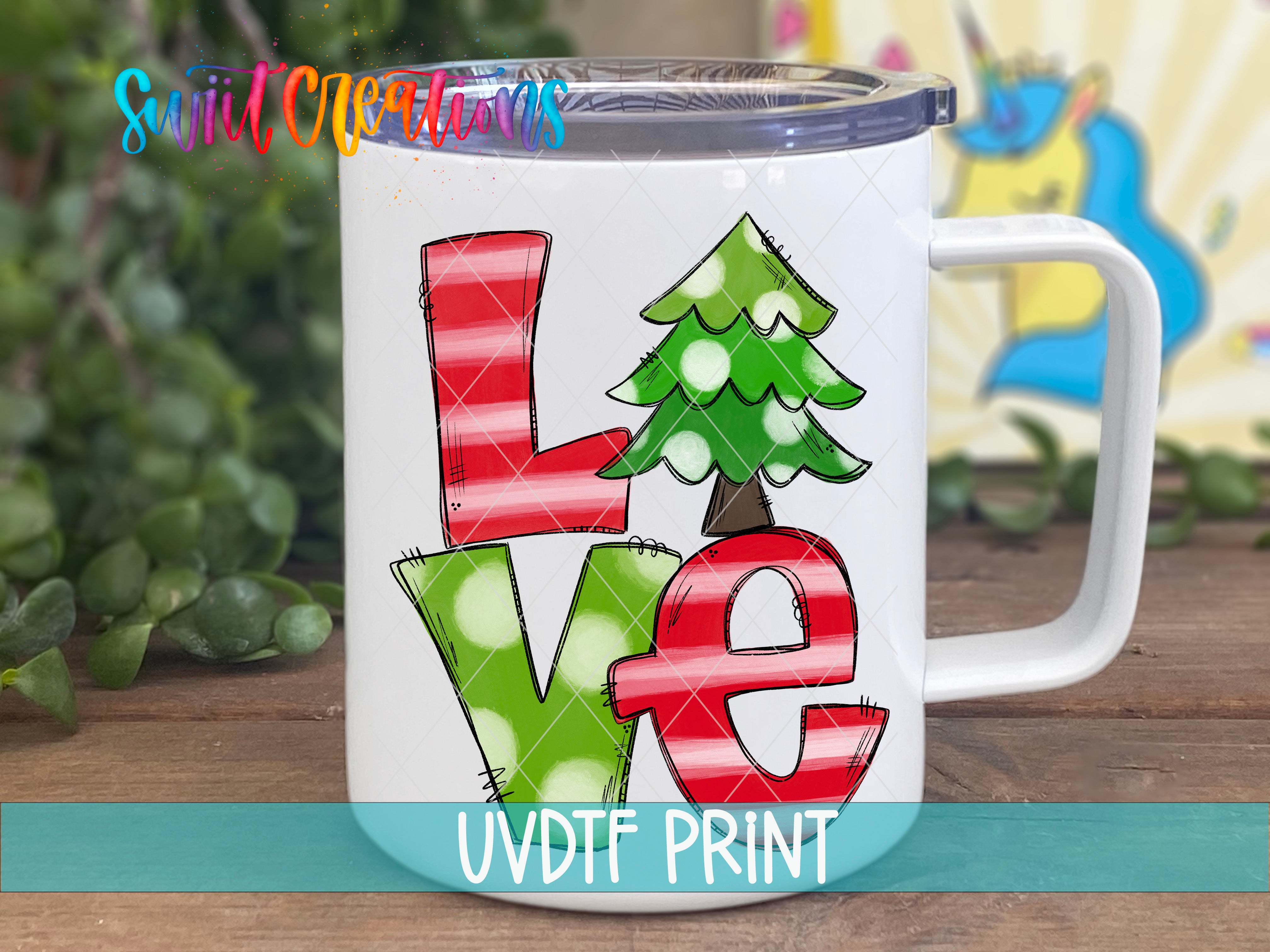 A white mug with a colorful design featuring the word "Love" in a stylized, cartoonish font.
