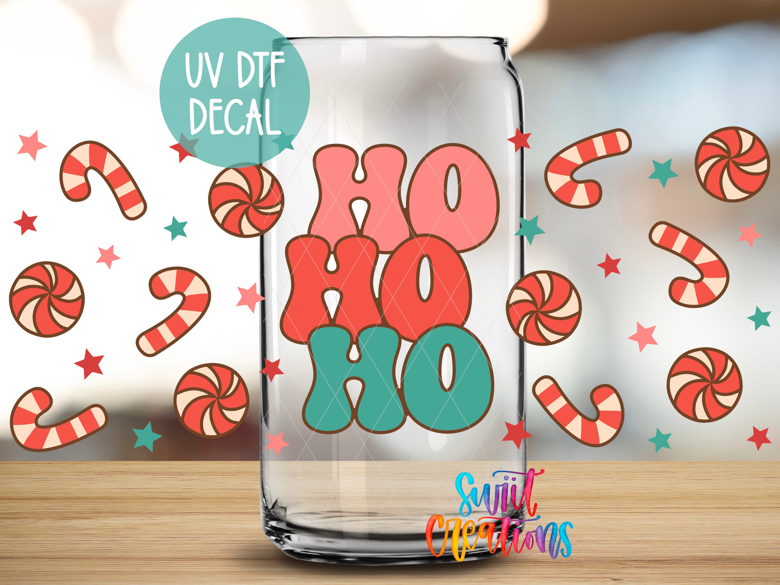 A glass jar with a UV decal featuring the text "HO HO HO" surrounded by colorful candy canes and stars.
