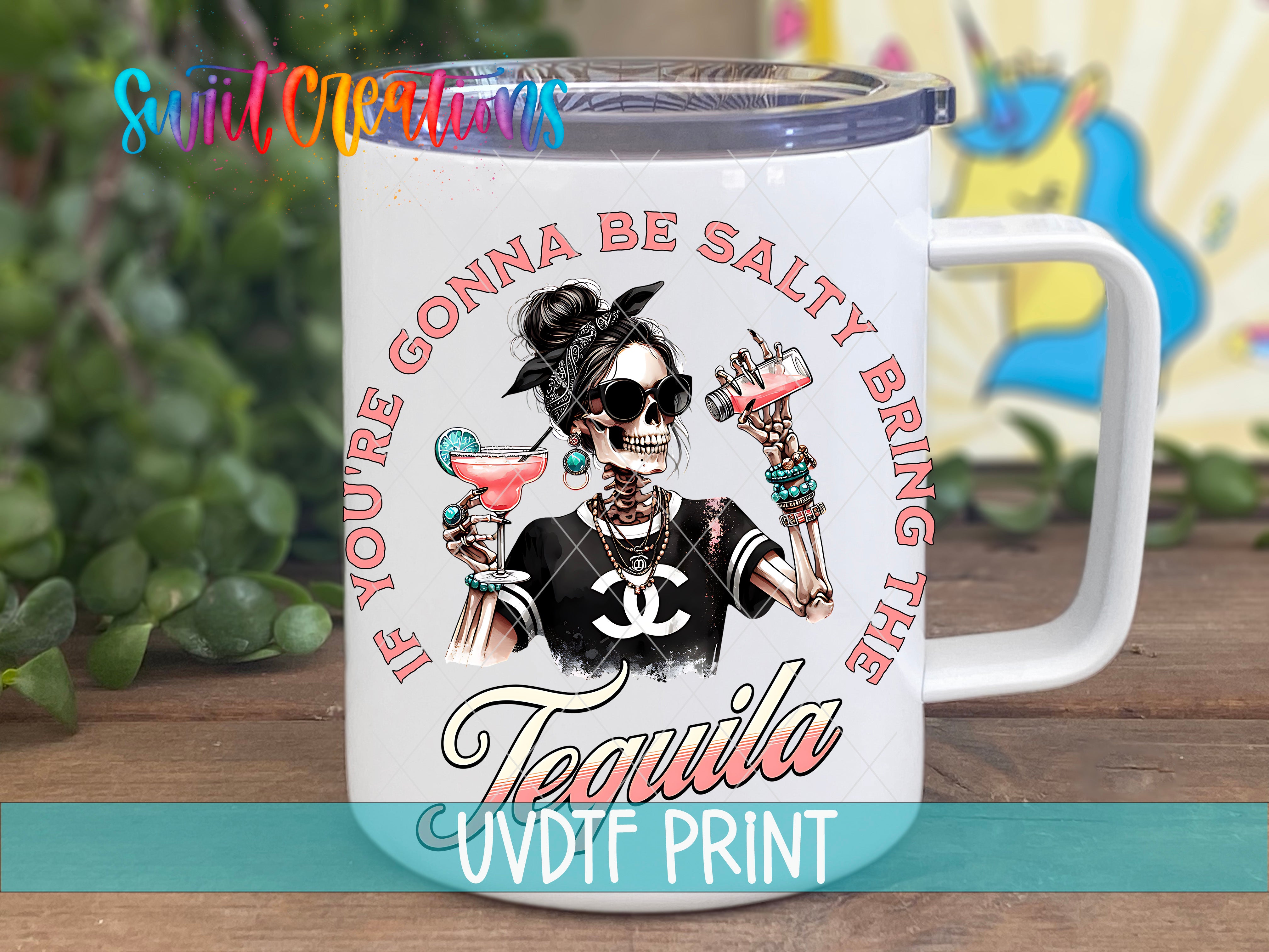A white mug with a colorful design featuring a skeleton holding a drink and the text "If you're gonna be salty bring the tequila" printed on it.