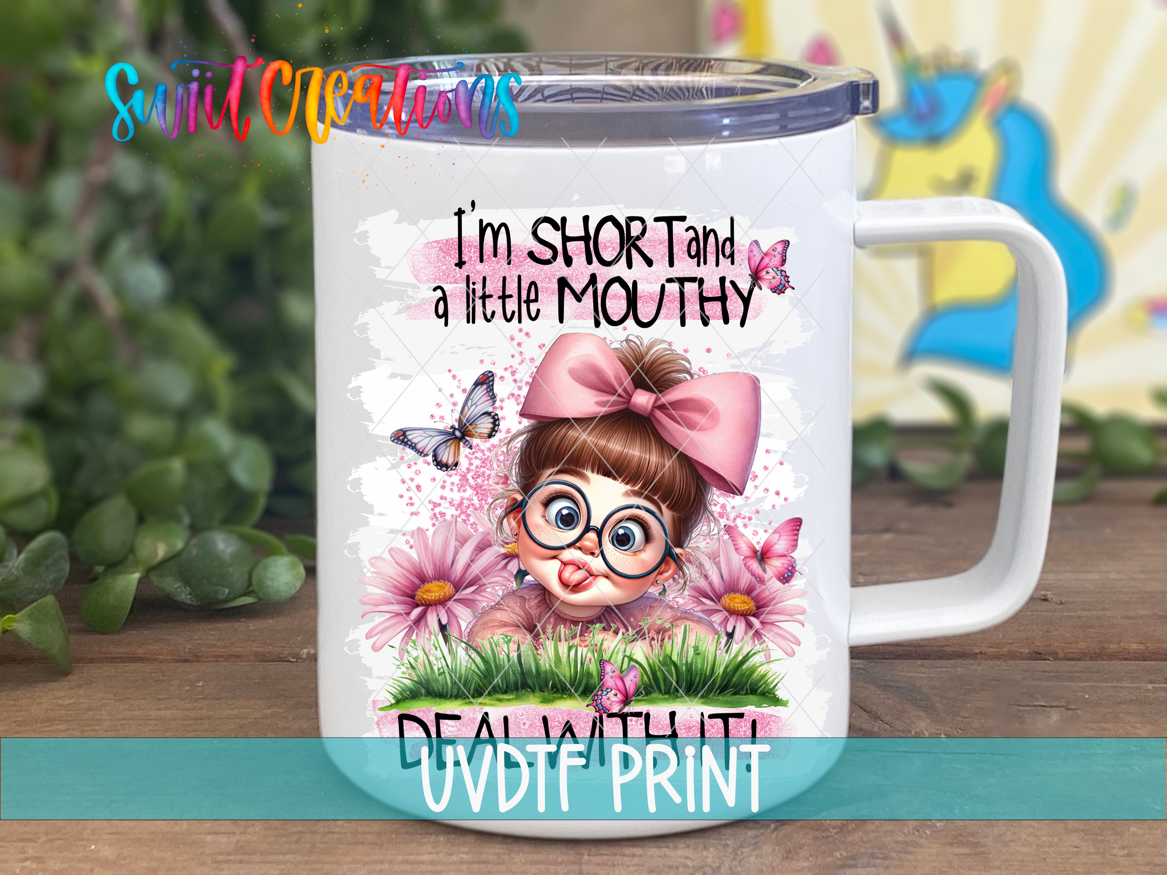 A white mug with a cartoon image of a young girl with a pink bow and glasses, surrounded by flowers and butterflies.