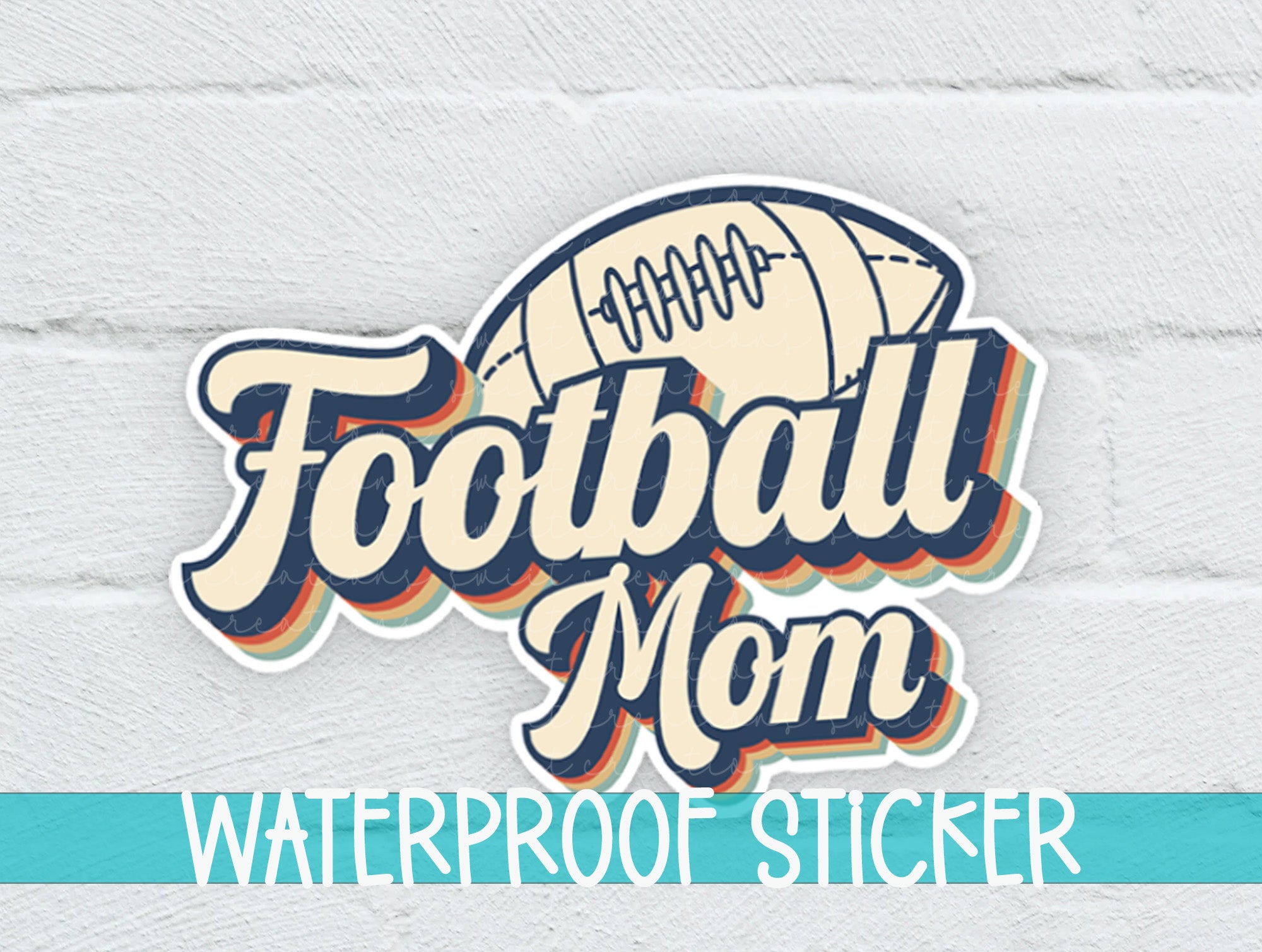a football mom waterproof sticker on a white brick wall