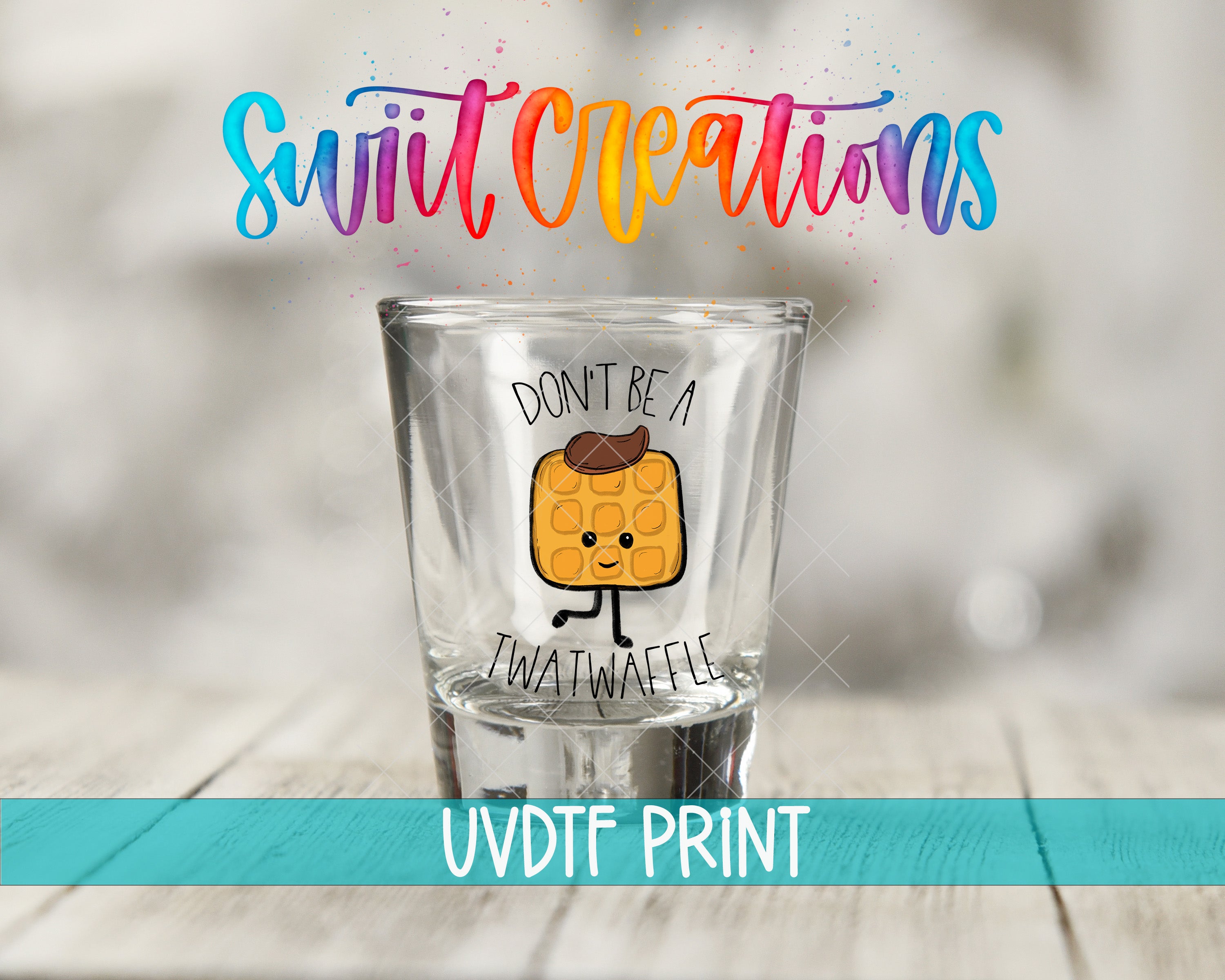 A shot glass with a cartoon waffle on it, accompanied by the text "Don't be a Twatwaffle" and "UVDF PRINT".