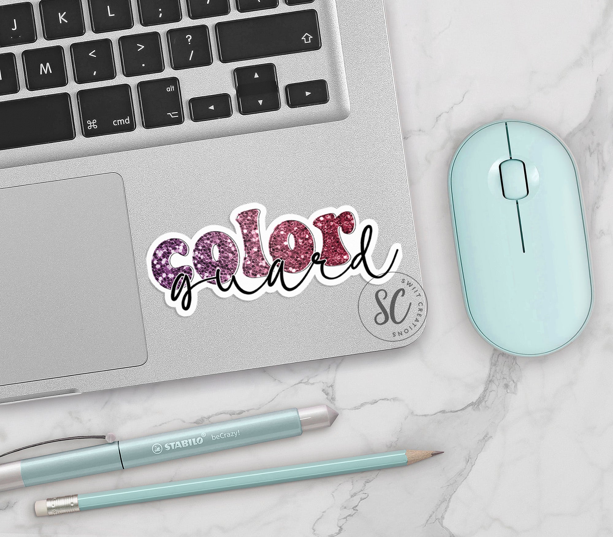 a laptop computer sitting next to a mouse and keyboard