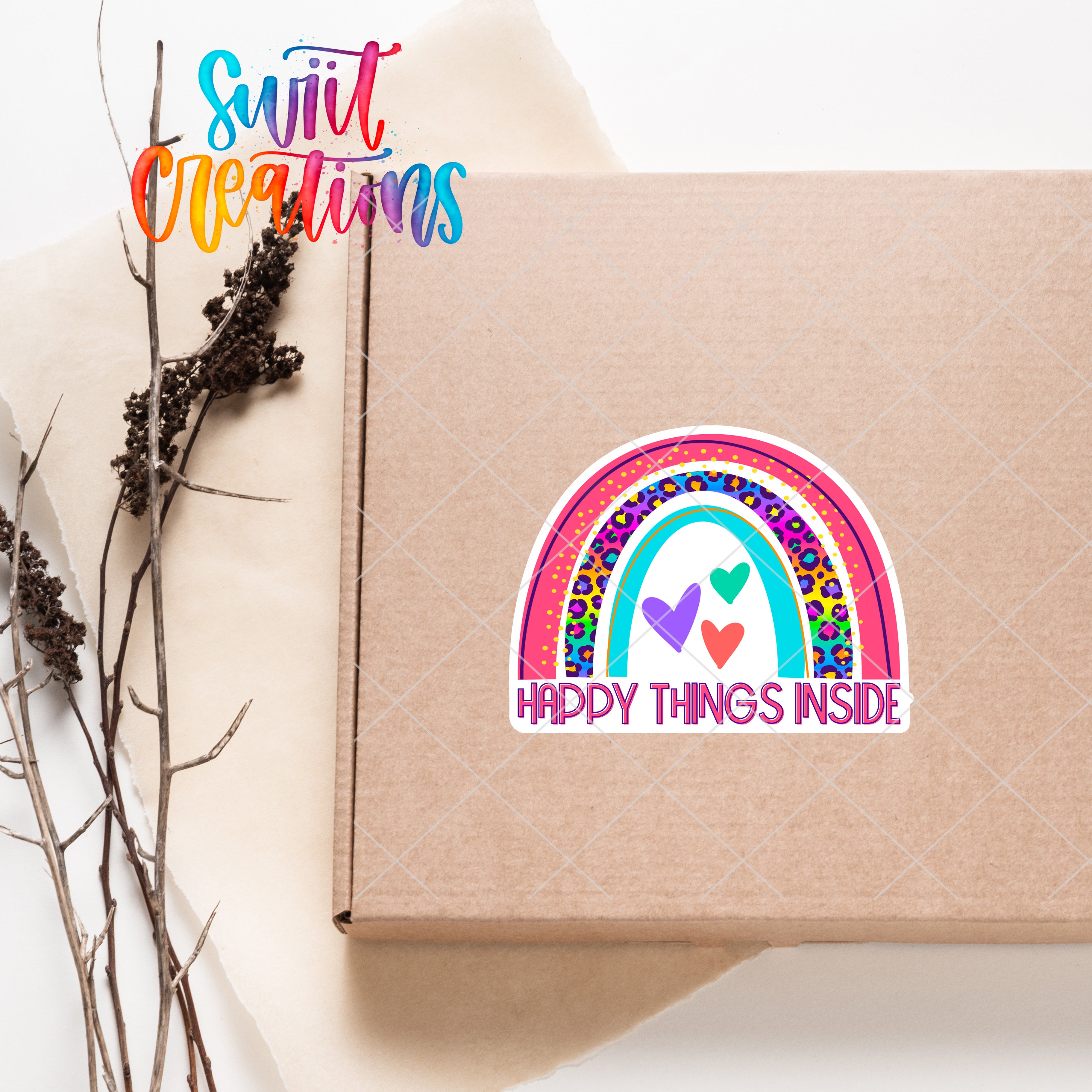 a box with a rainbow sticker on it