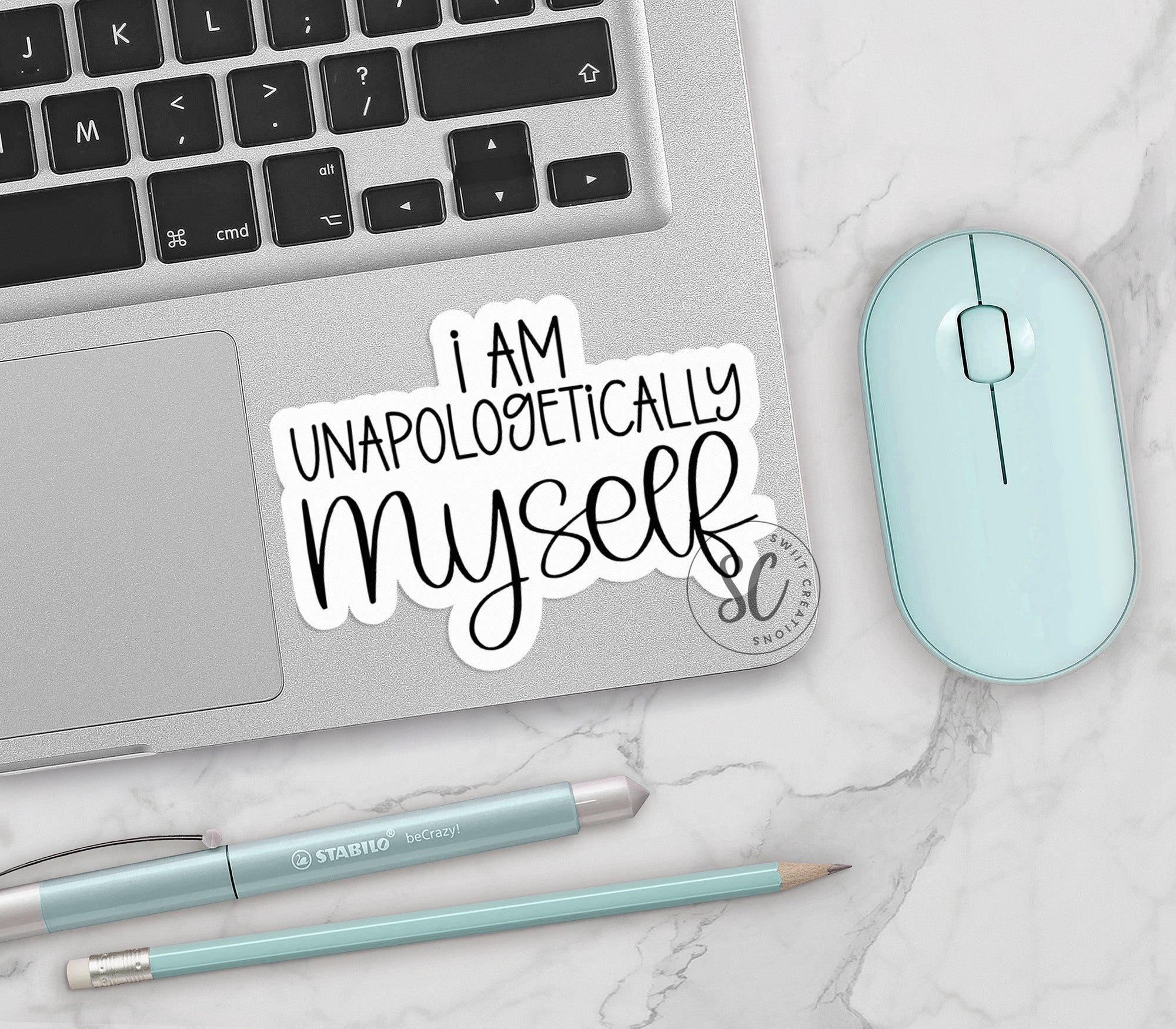 a laptop computer sitting on top of a white counter