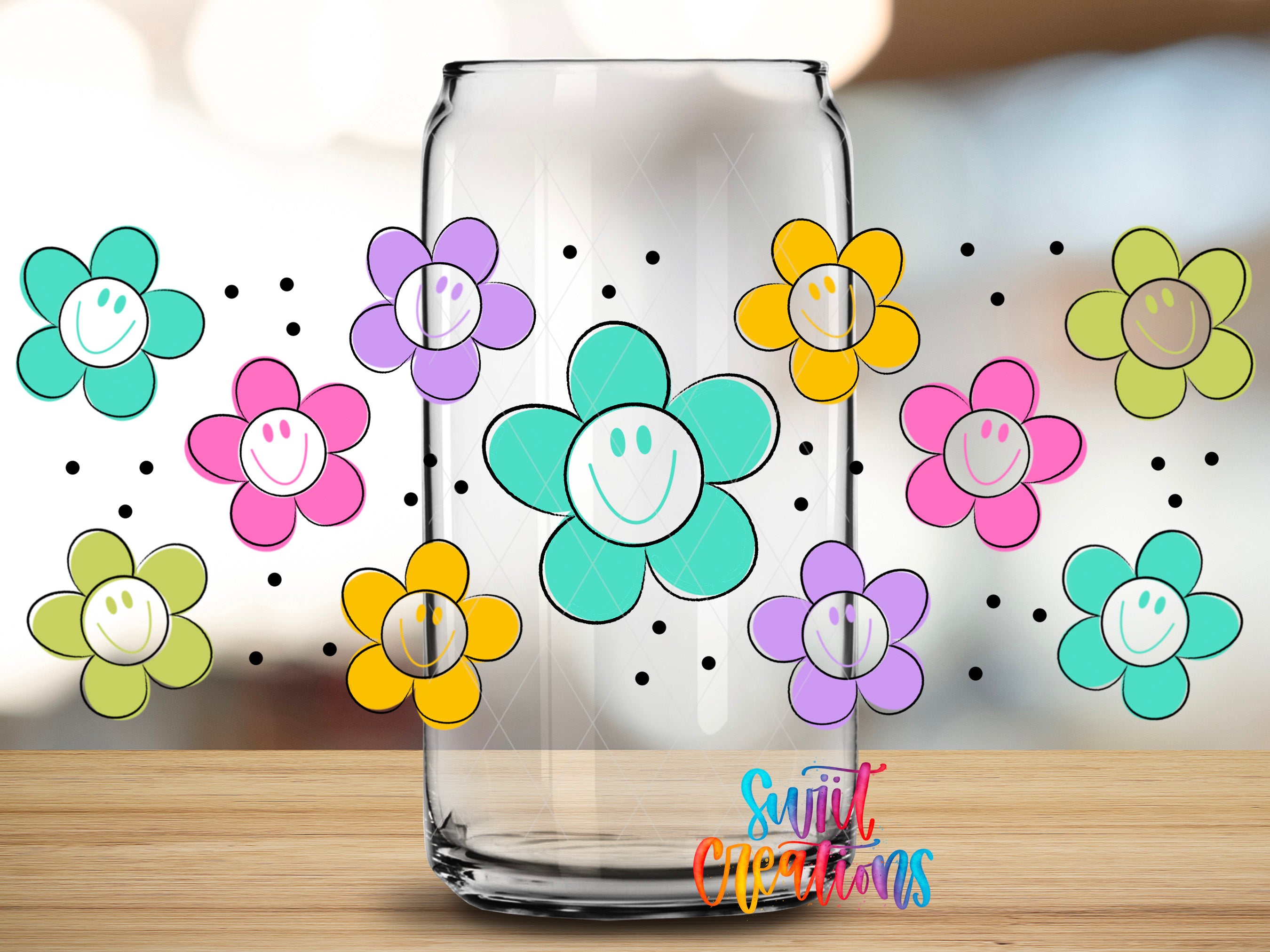 A clear glass jar with colorful flower-like illustrations on it, placed on a wooden surface.