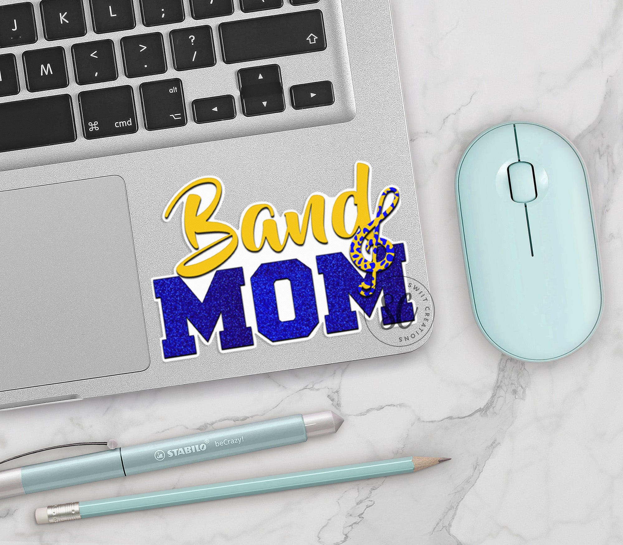 a laptop computer sitting next to a mouse and keyboard