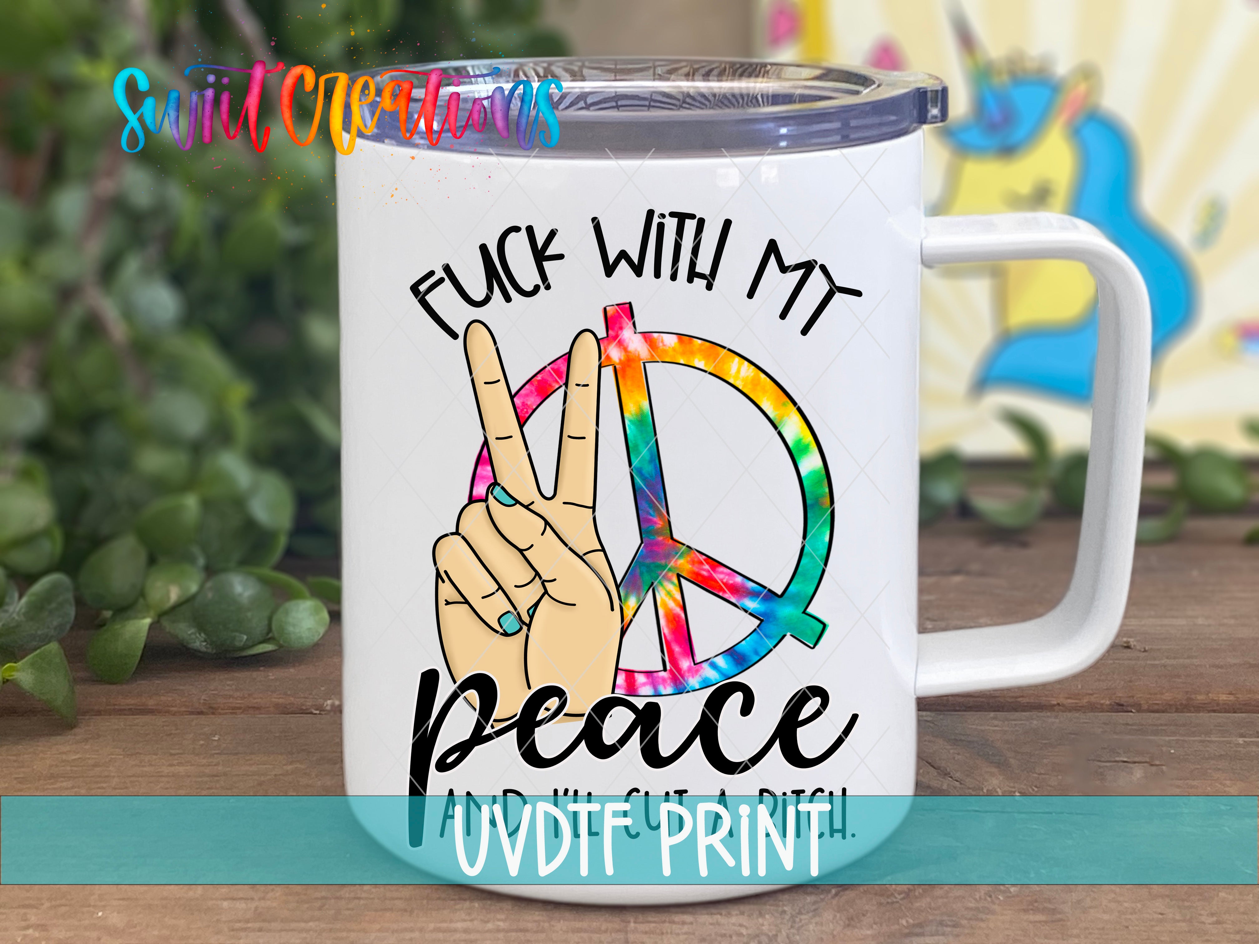 A white ceramic mug with a peace sign and the text "FUCK WITH MY PEACE AND IT'S A RITCH" printed on it.