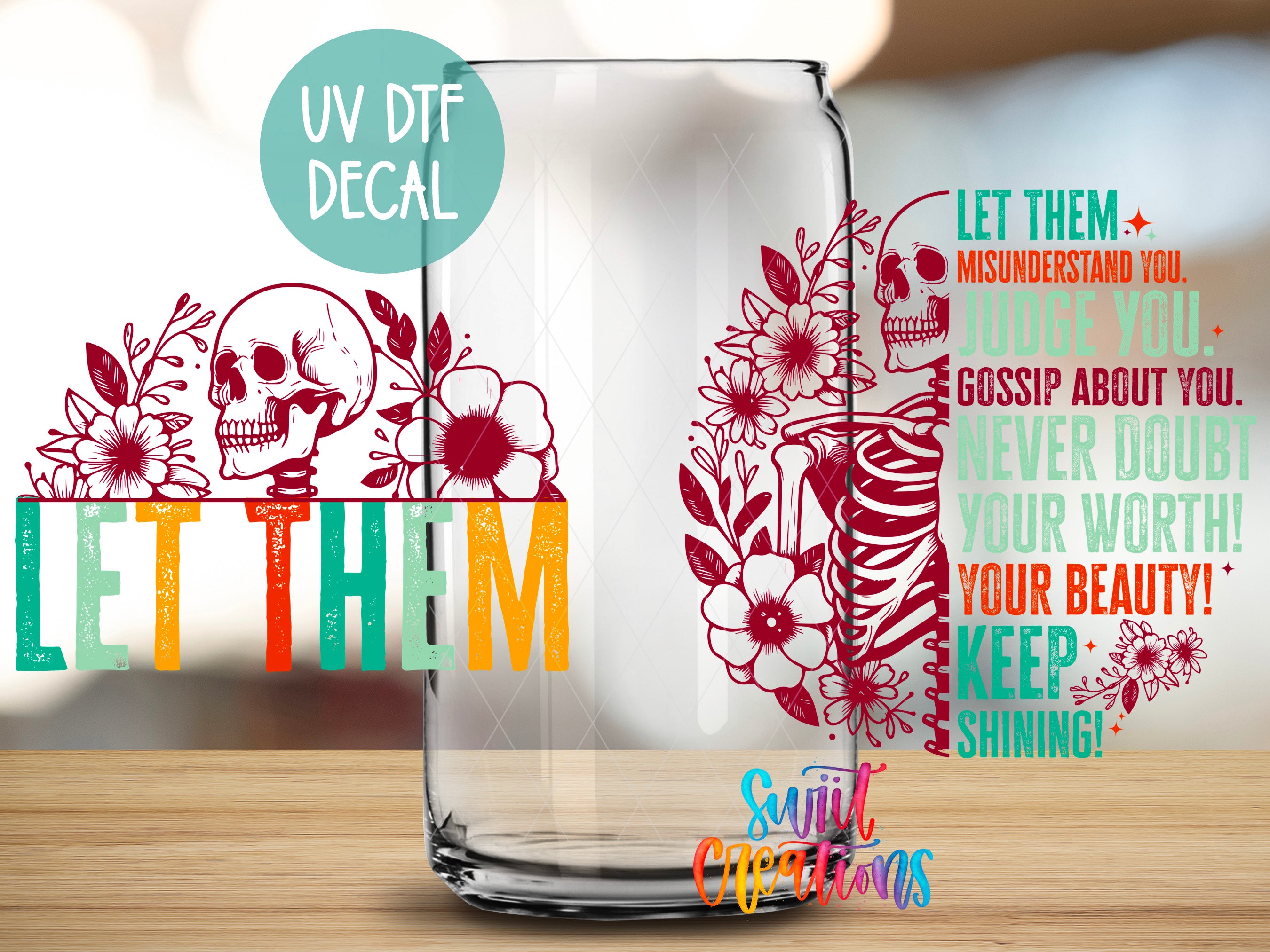 a glass with a skull and flowers on it