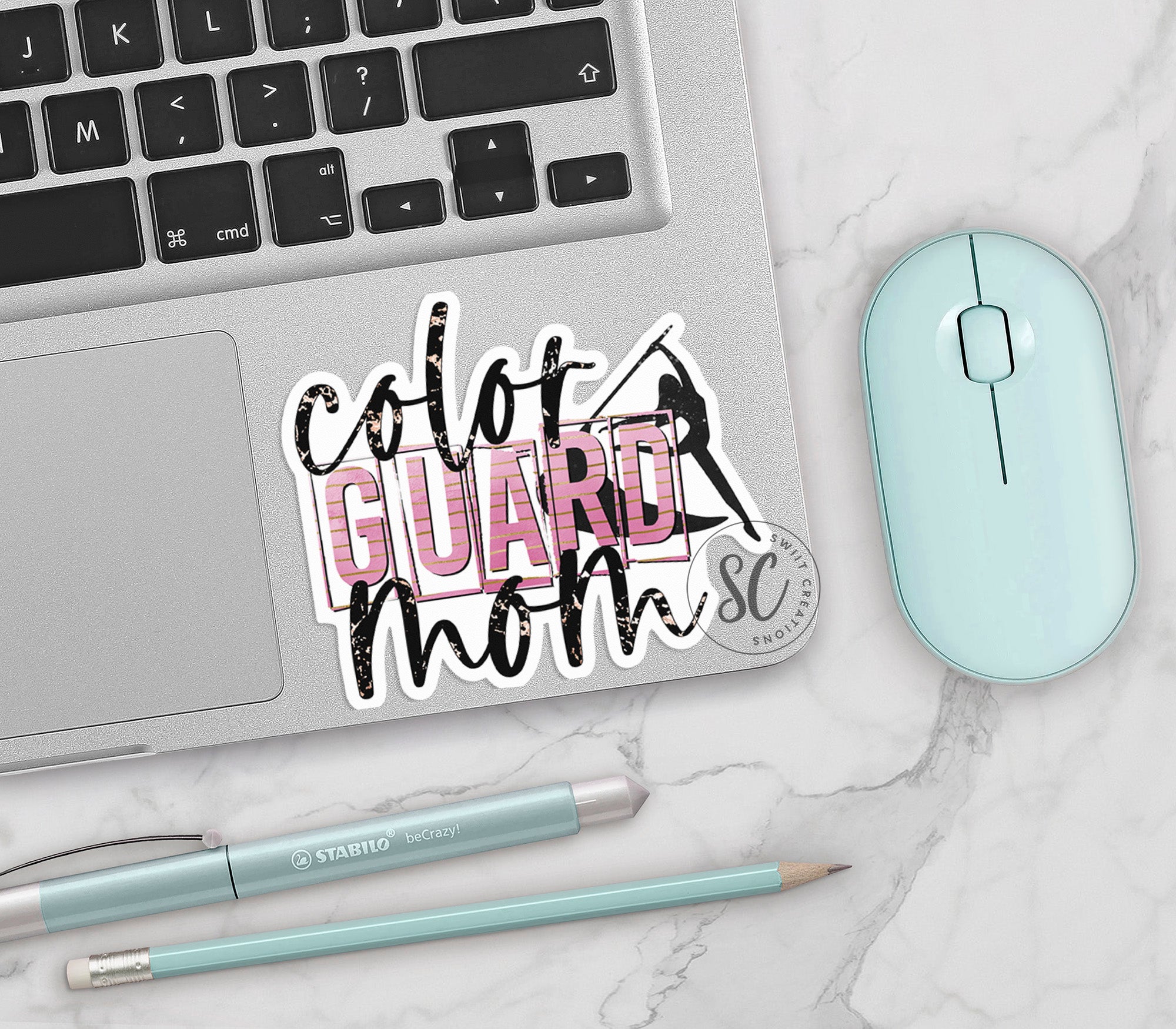 a laptop computer sitting next to a mouse and keyboard