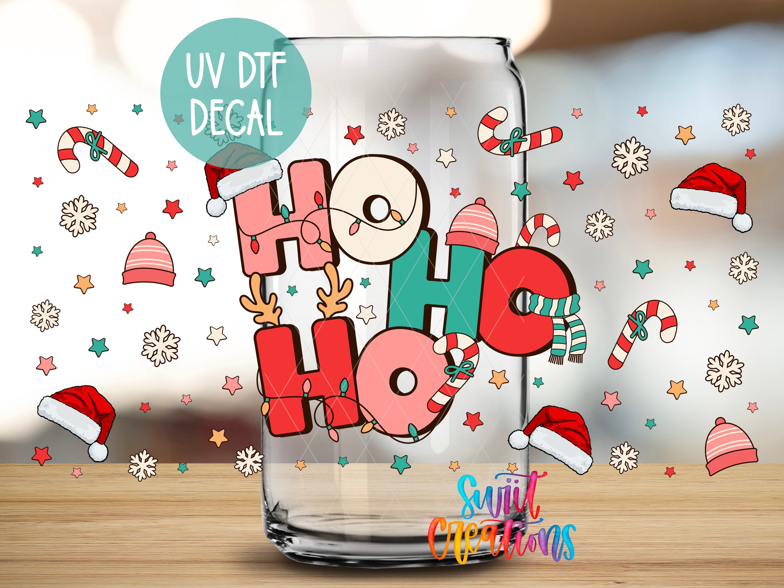 A glass with a UV decal featuring the word "HOOKY HOOKY" surrounded by Christmas-themed elements such as snowflakes, candy canes, and Santa hats.