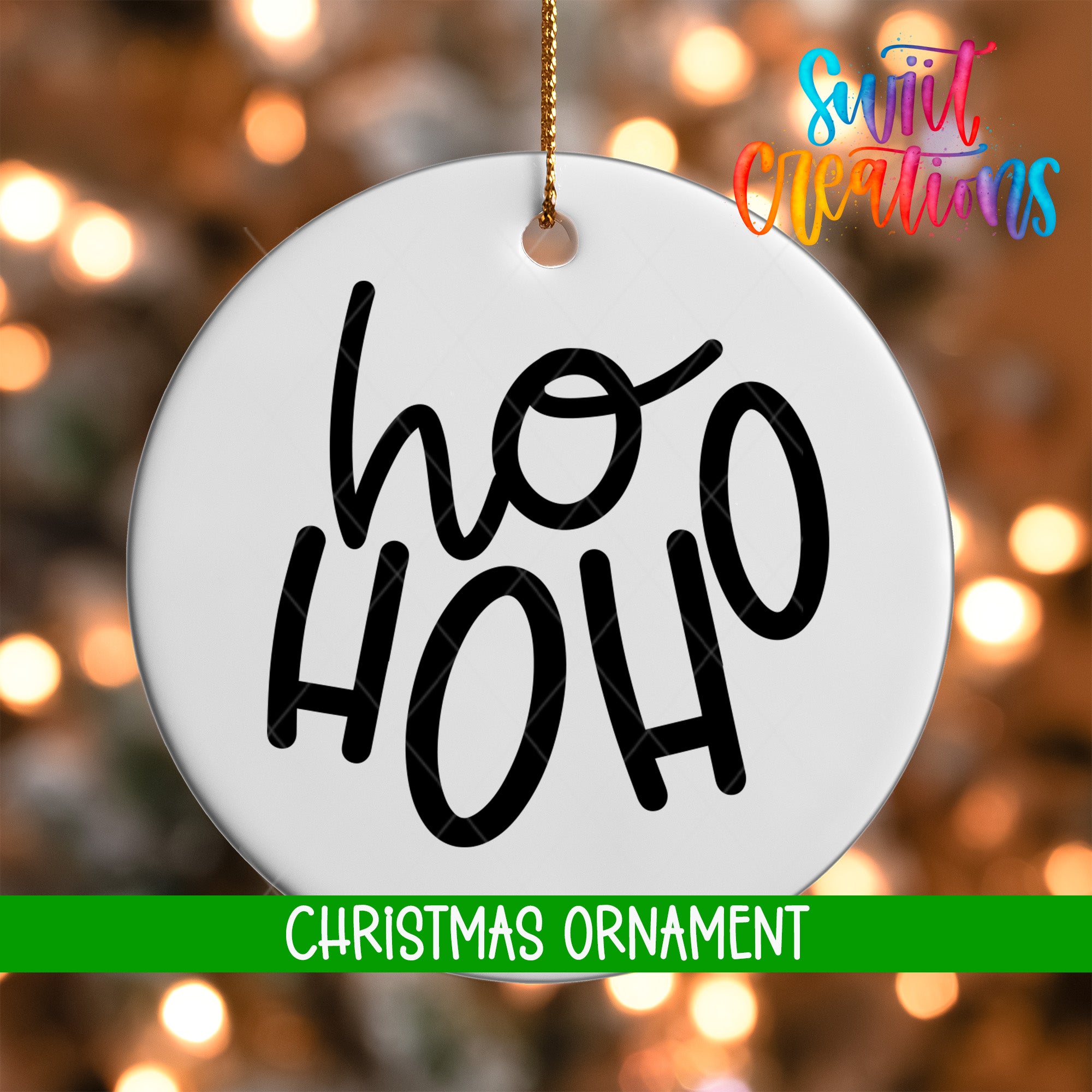 A white Christmas ornament with the text "ho ho" in black cursive letters.