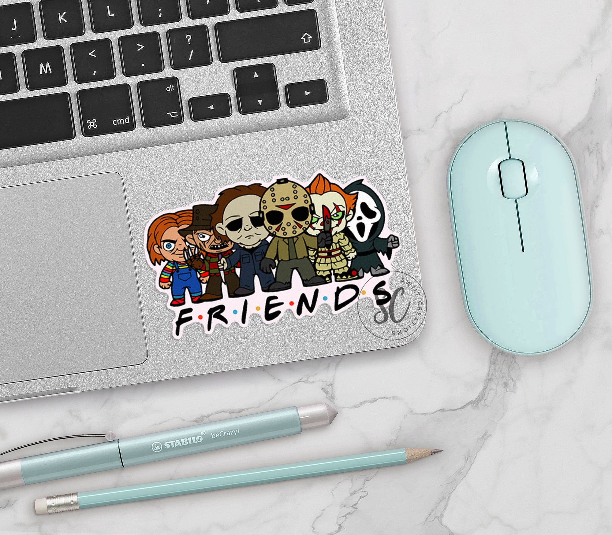 a laptop computer sitting on top of a white table