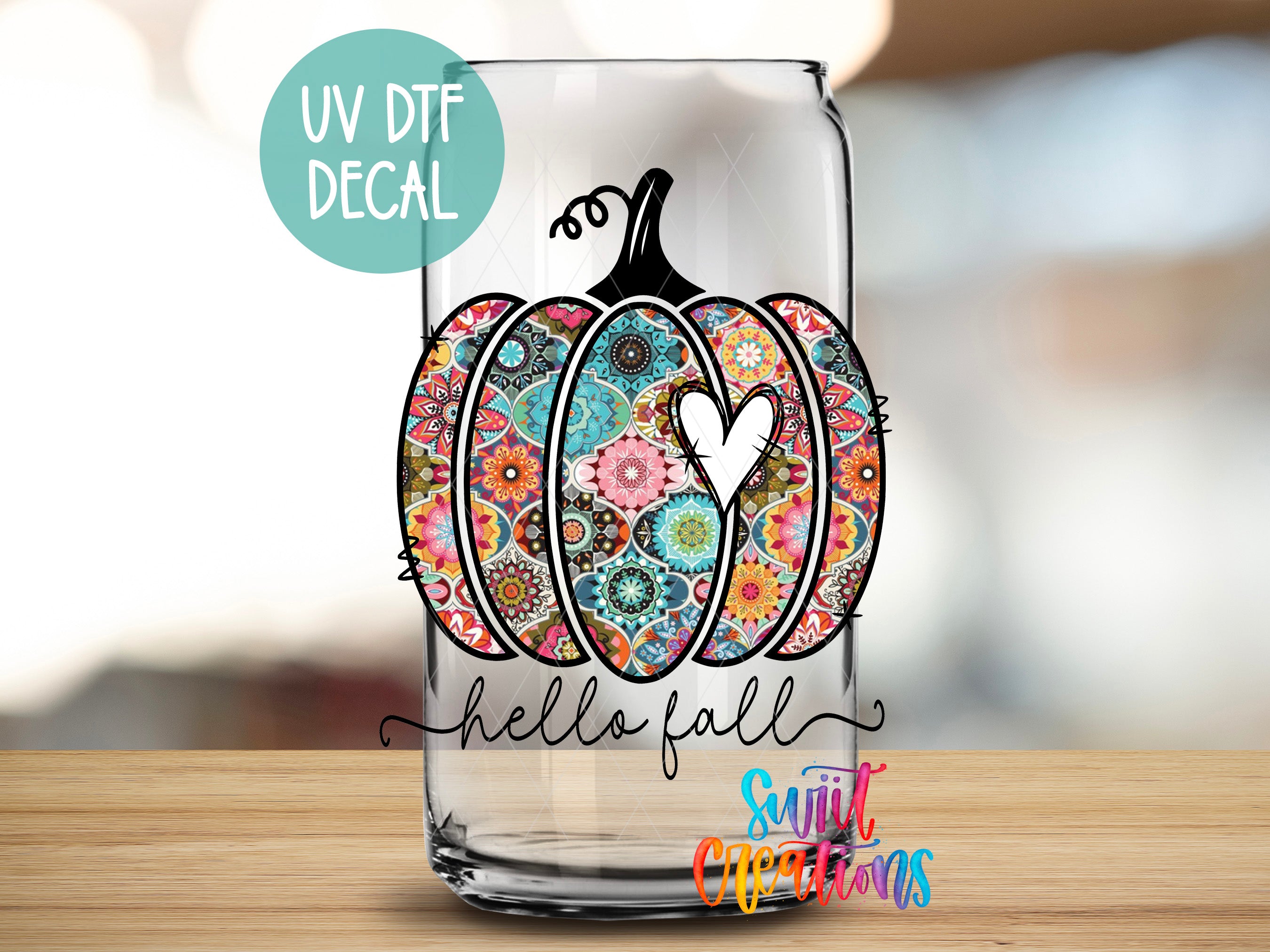 a glass that has a picture of a pumpkin on it