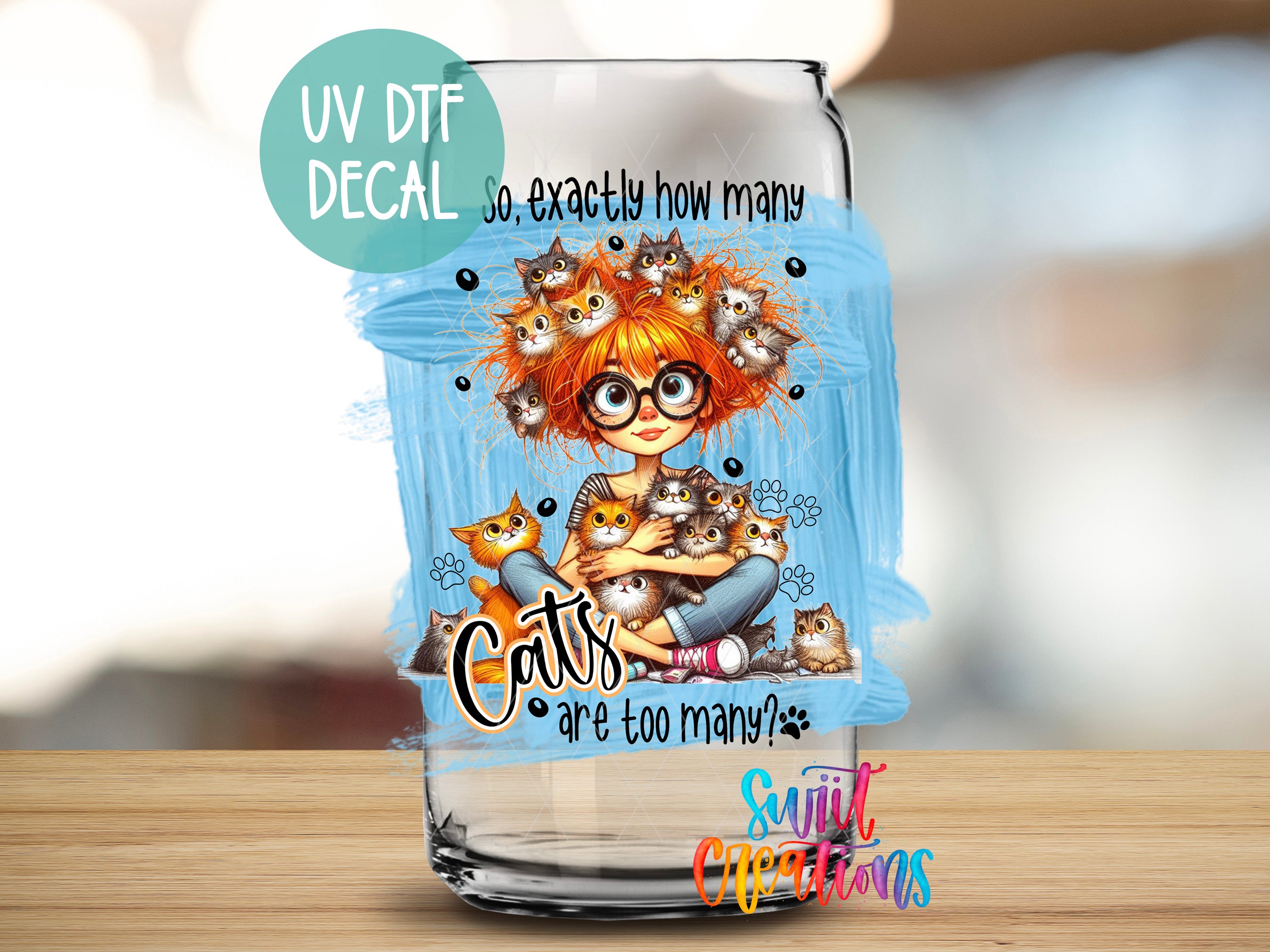 a glass with a picture of a girl with cats on it