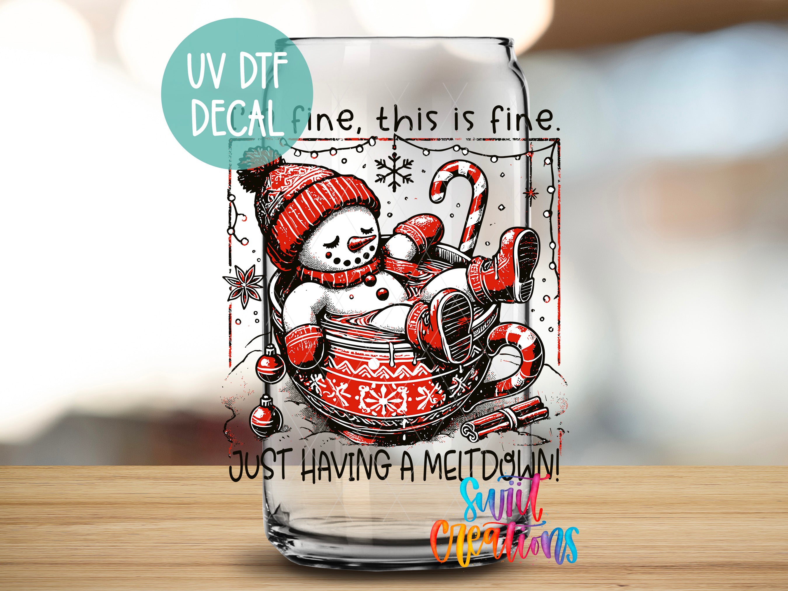 a glass with a picture of a snowman inside of it