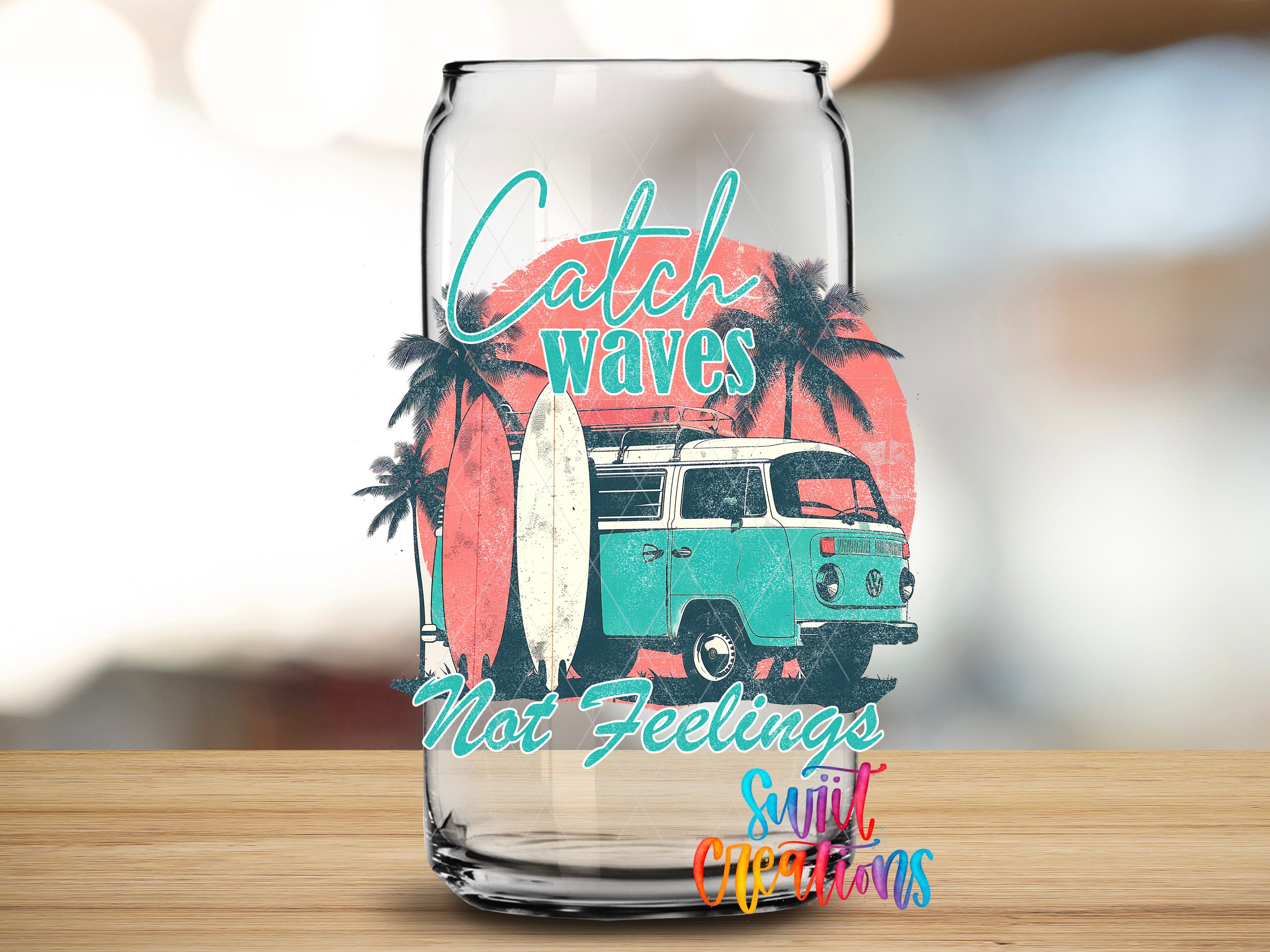 A glass can with a graphic design featuring a surfboard, palm trees, and a vintage van, along with the text "Catch Waves Not Feelings Sweet Dreams".