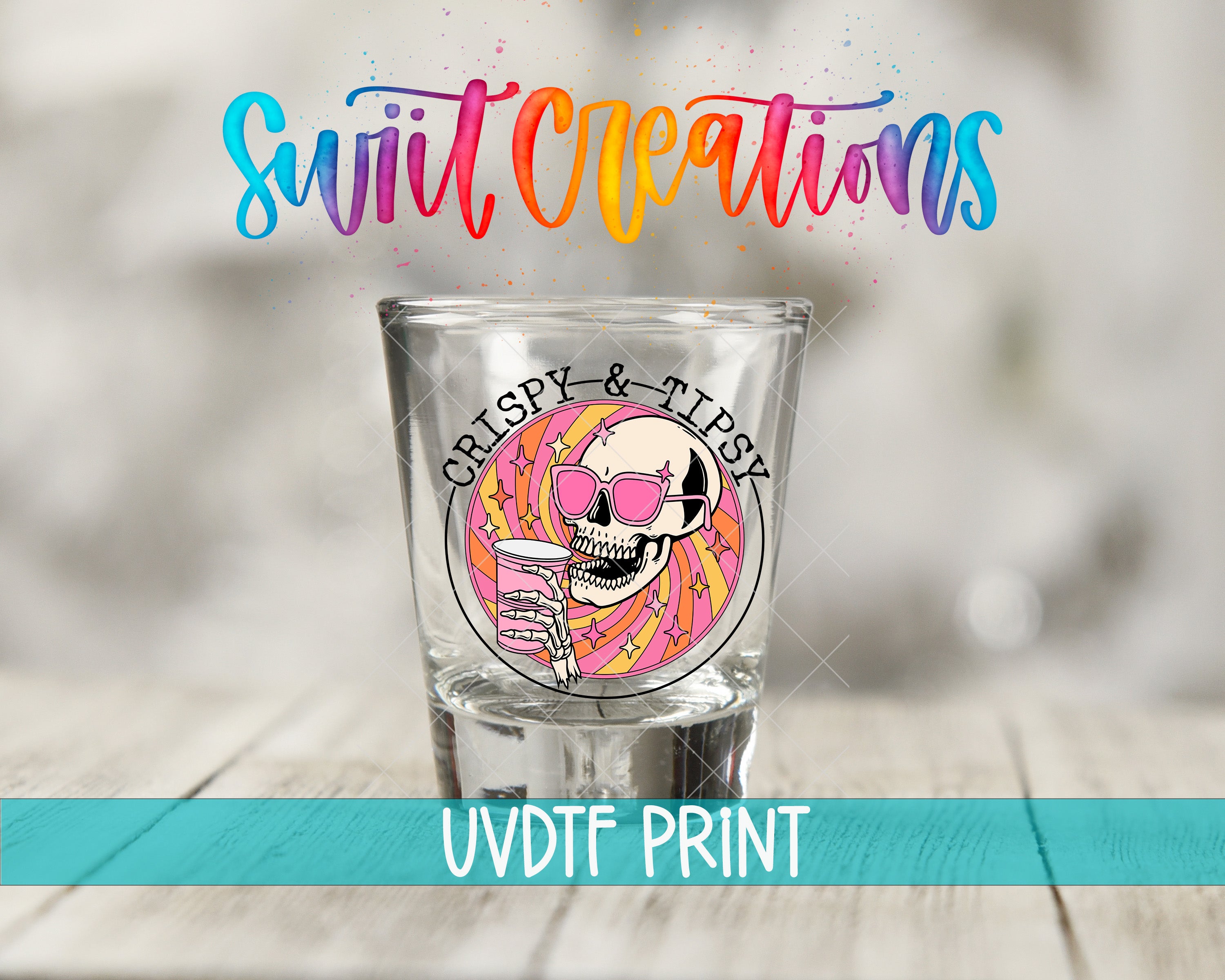 A shot glass with a skull and flamingo design, along with the text "Swift Creations" and "Gripsy & Tipsy" printed on it.