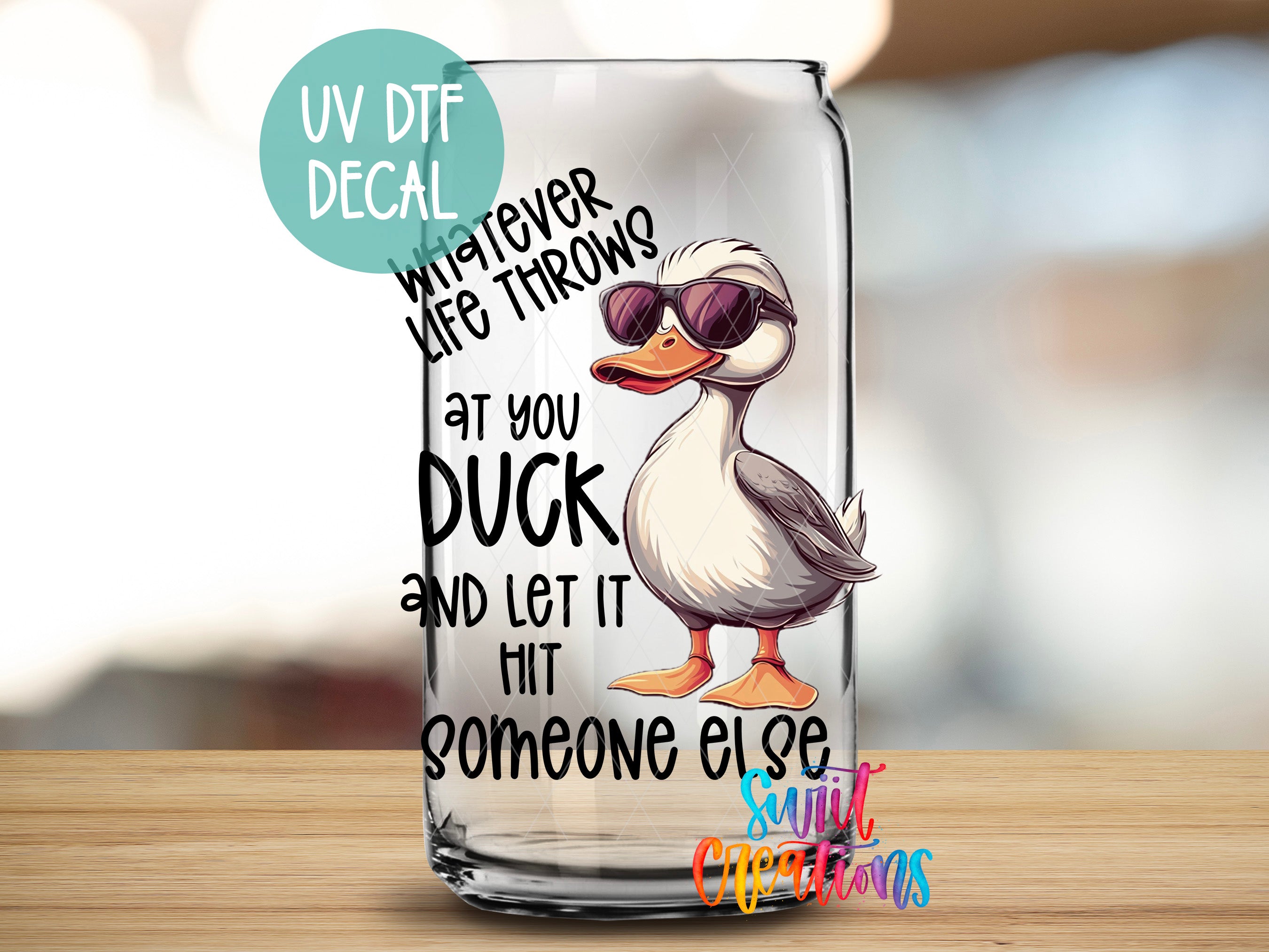 a glass with a picture of a duck wearing sunglasses