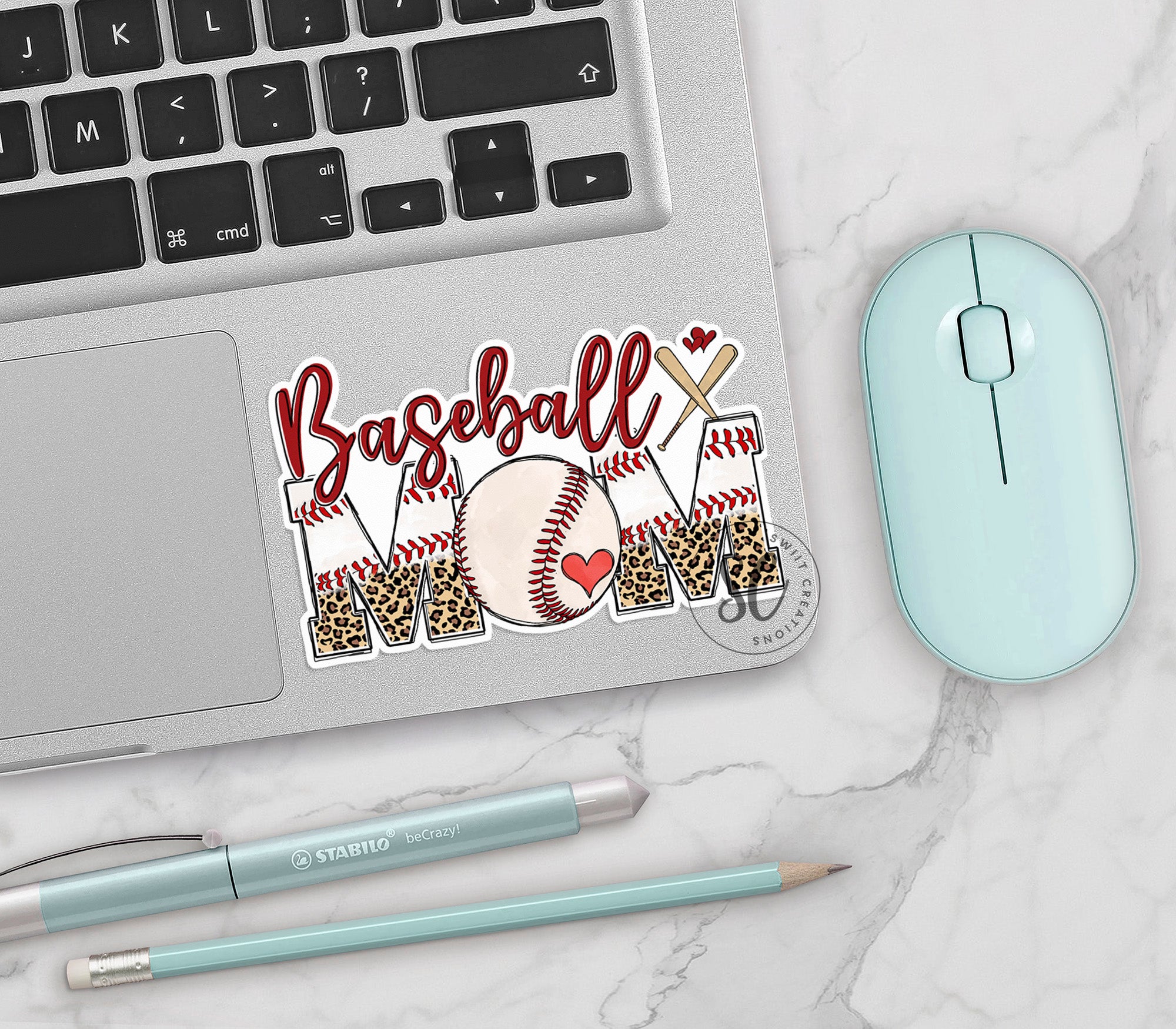 a laptop computer sitting next to a mouse