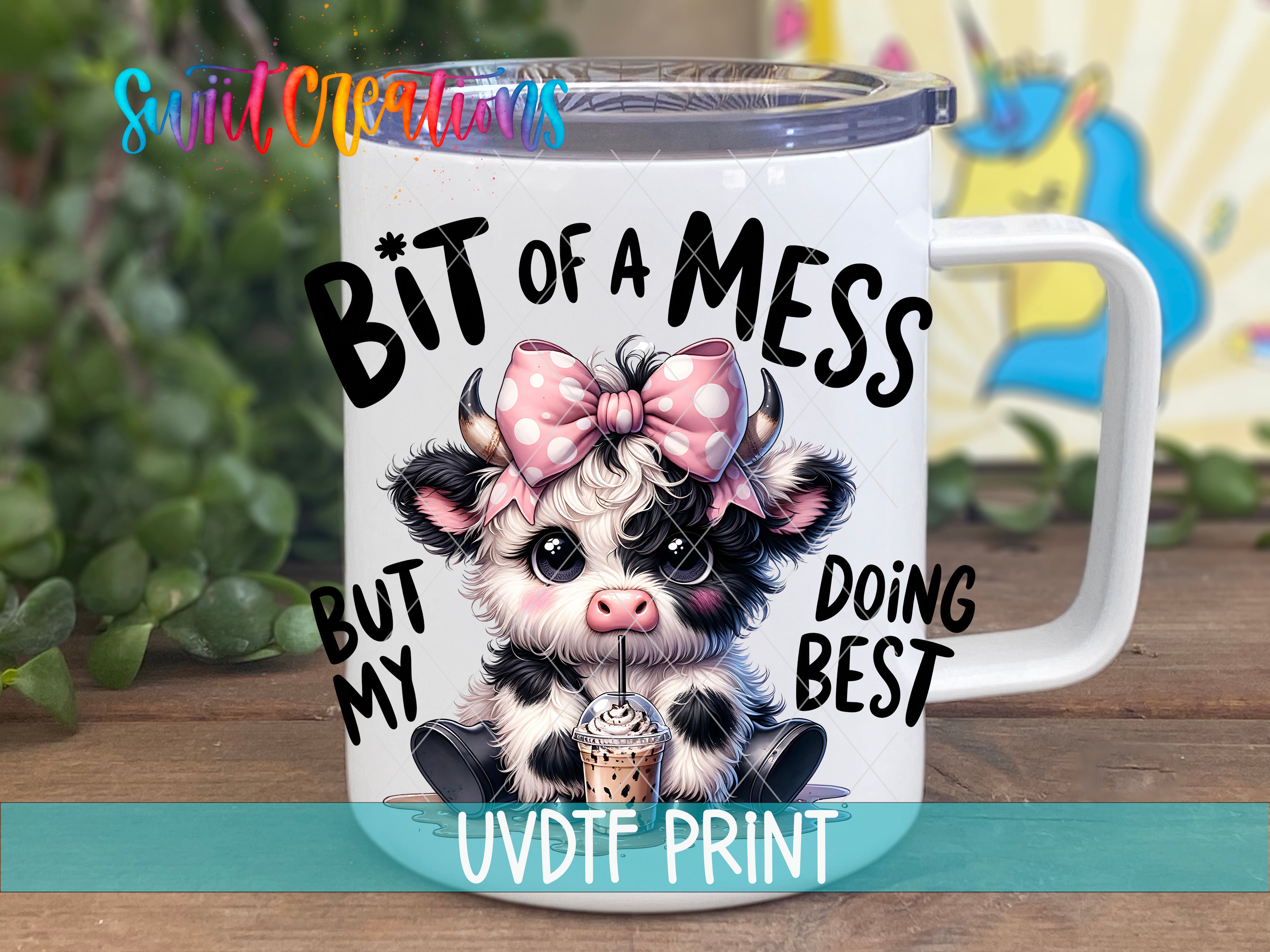 A white mug with a cartoon cow design and text printed on it.