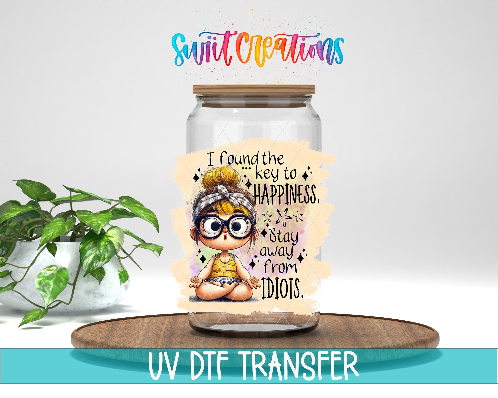 a glass jar with a sticker of a cartoon girl and a message about finding the key to happiness. The jar is placed on a wooden surface, and there is a potted plant in the background.