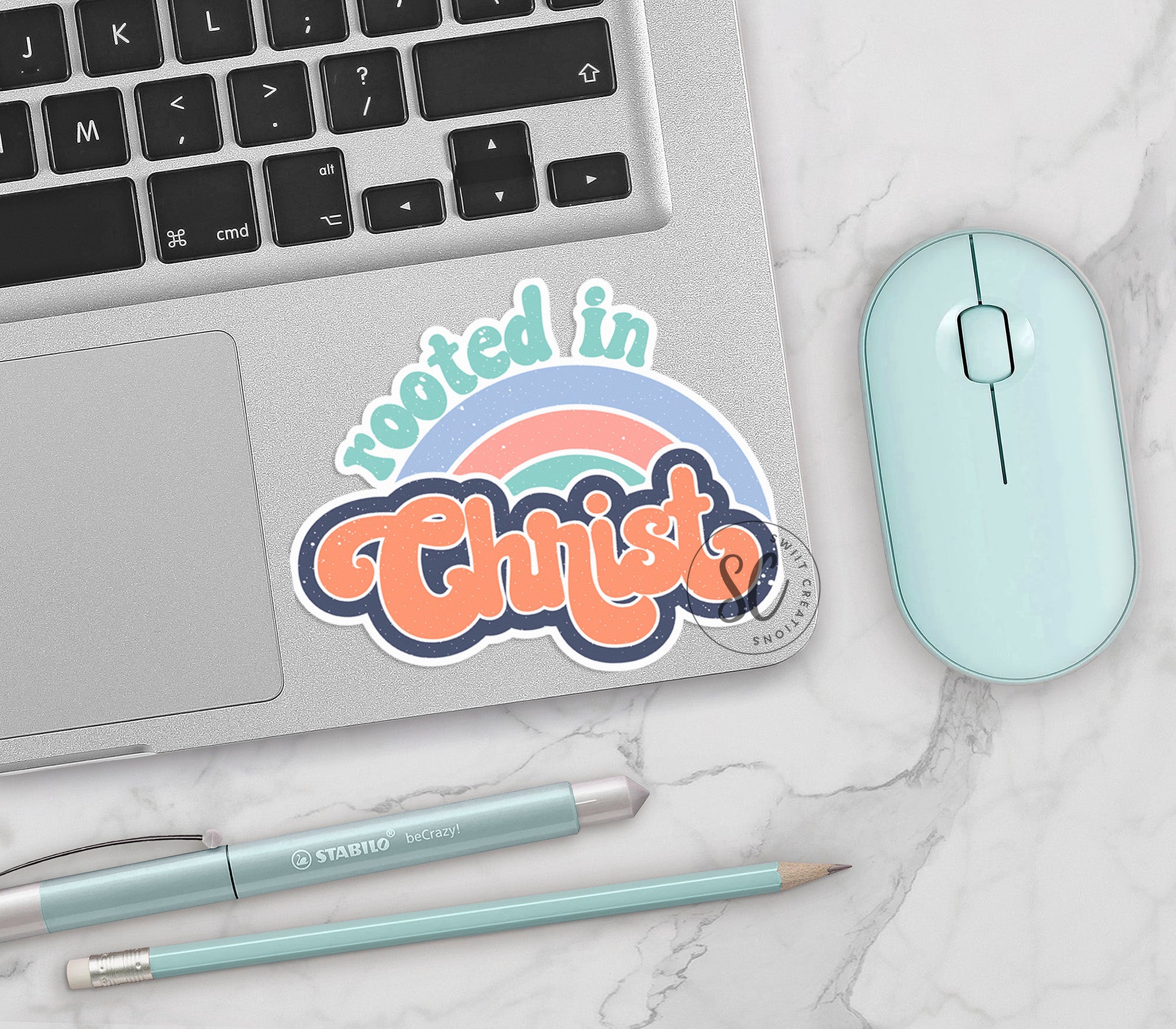 a laptop computer sitting on top of a white table