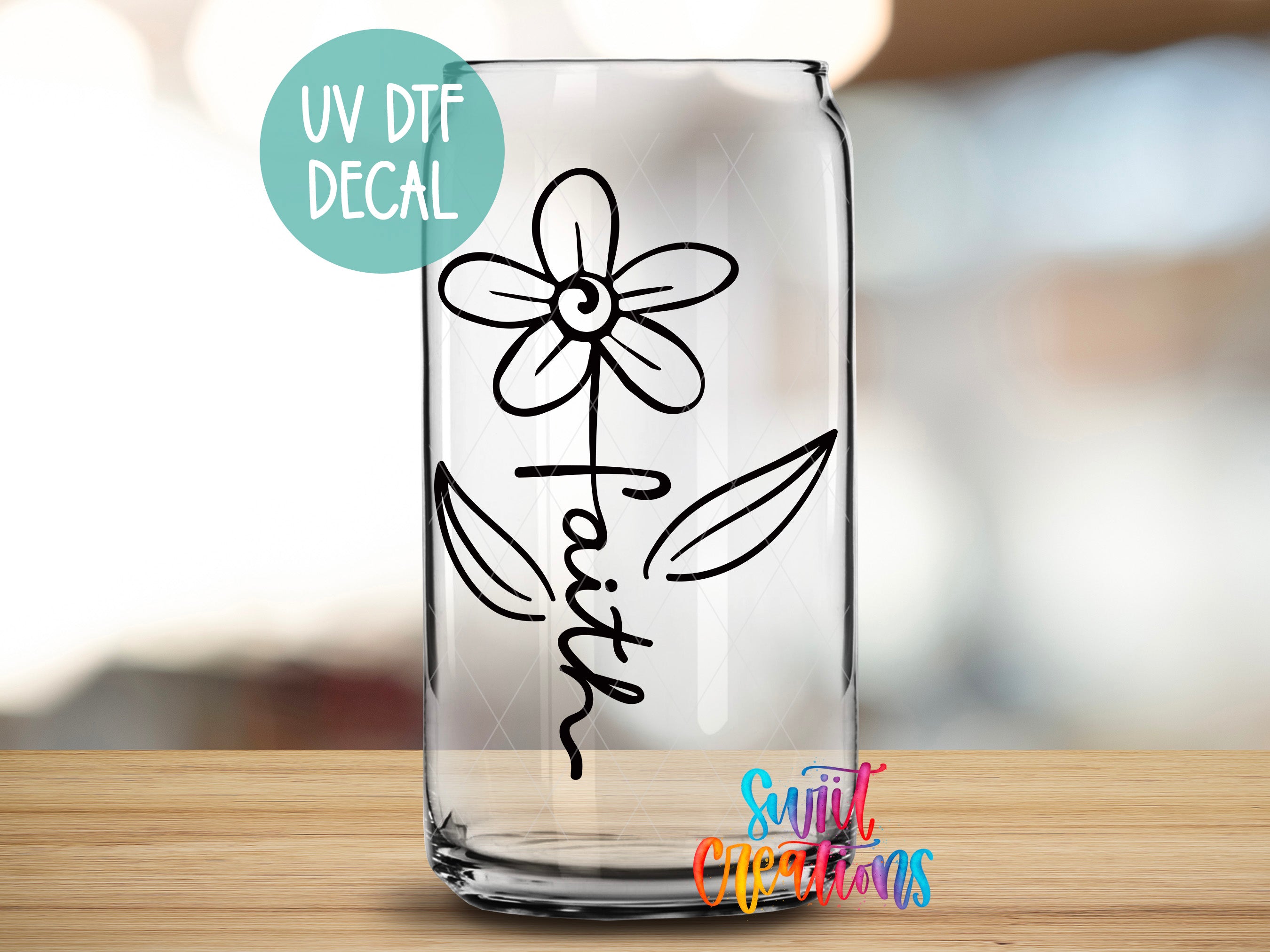 a glass with a flower drawn on it