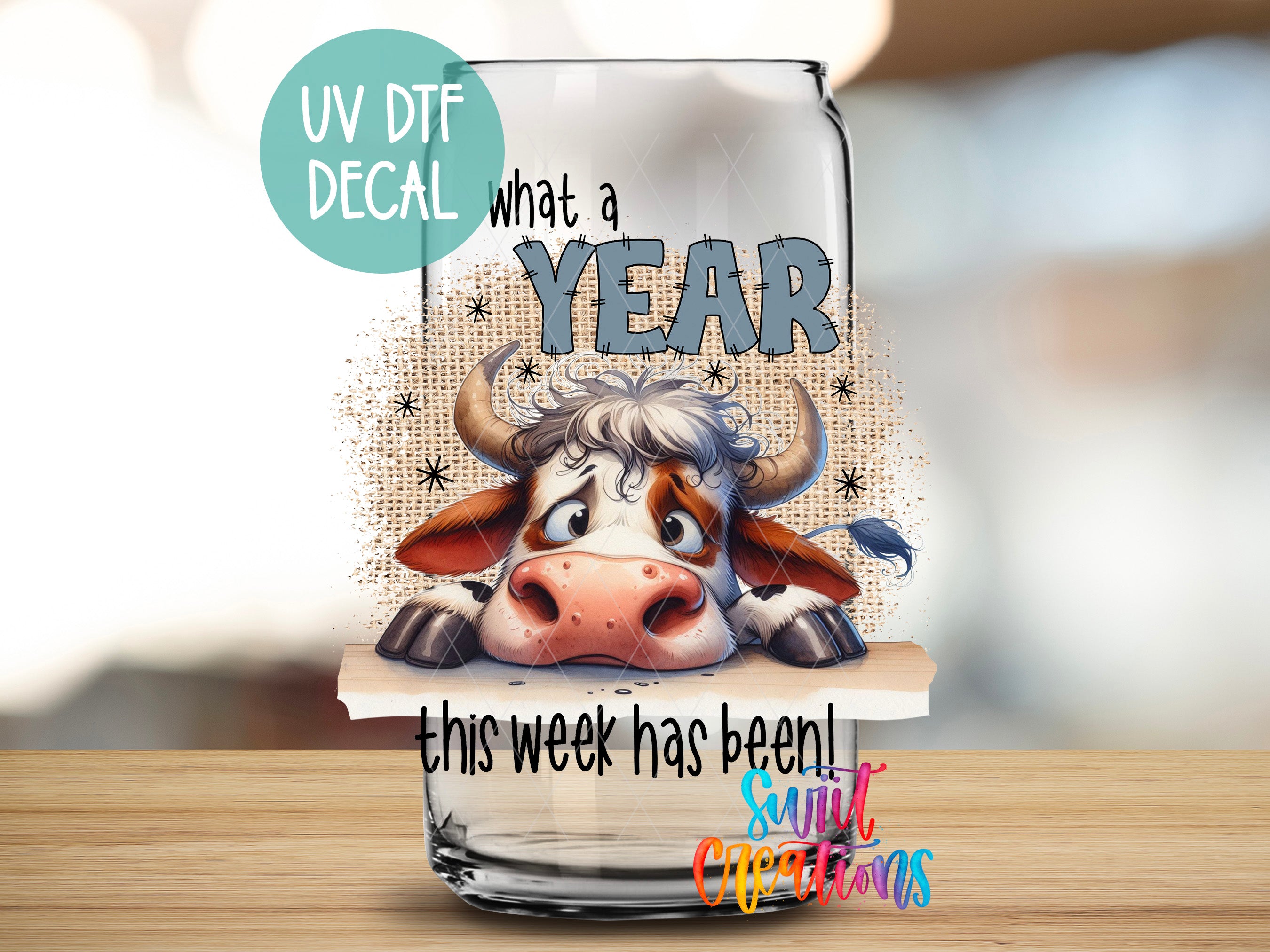 a glass with a picture of a cow on it