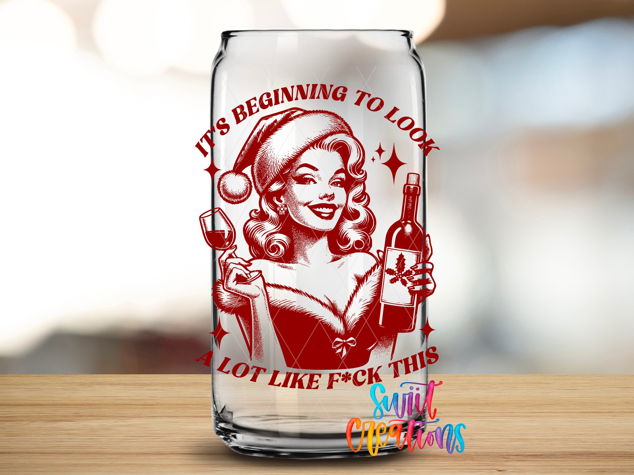 A glass can with a red and white design featuring a smiling woman wearing a Santa hat and holding a wine glass.