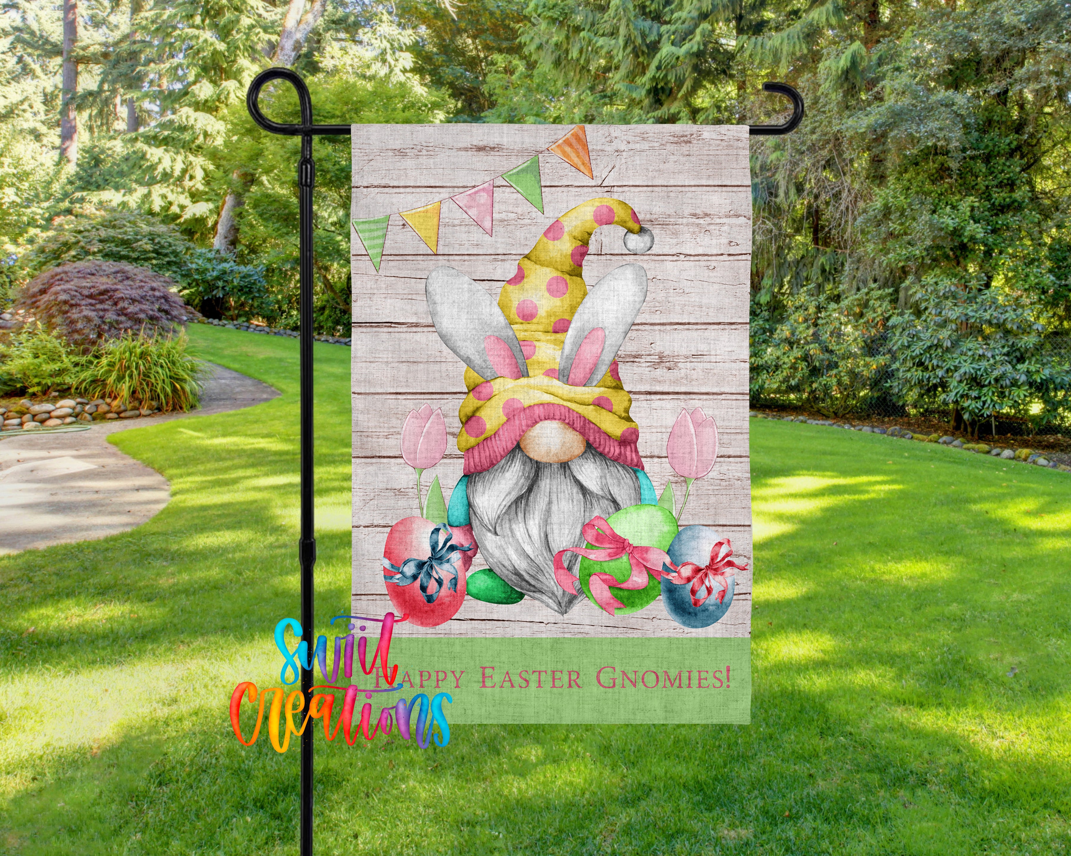 A garden gnome decoration with Easter-themed elements, including a bunny hat, eggs, and flowers, is displayed on a garden flag.