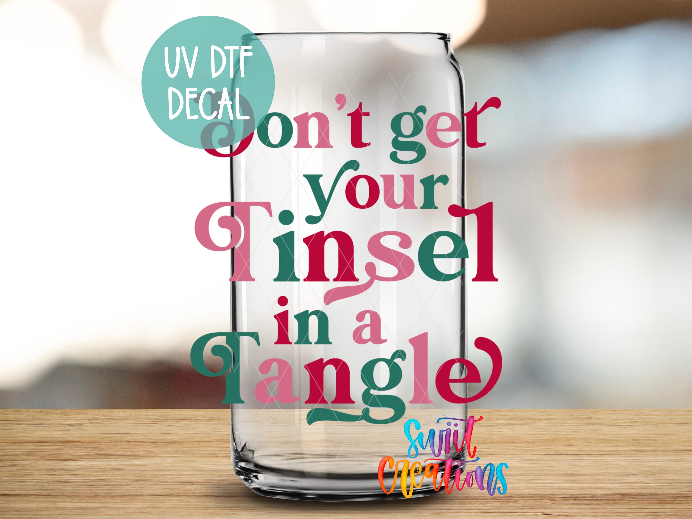 a glass can with a message written on it, placed on a wooden surface.