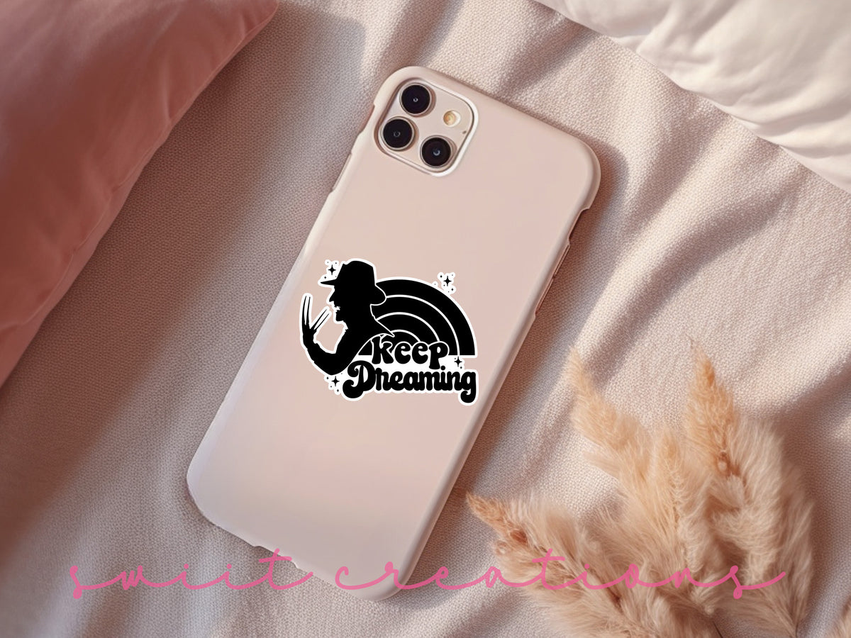 a phone case sitting on top of a bed
