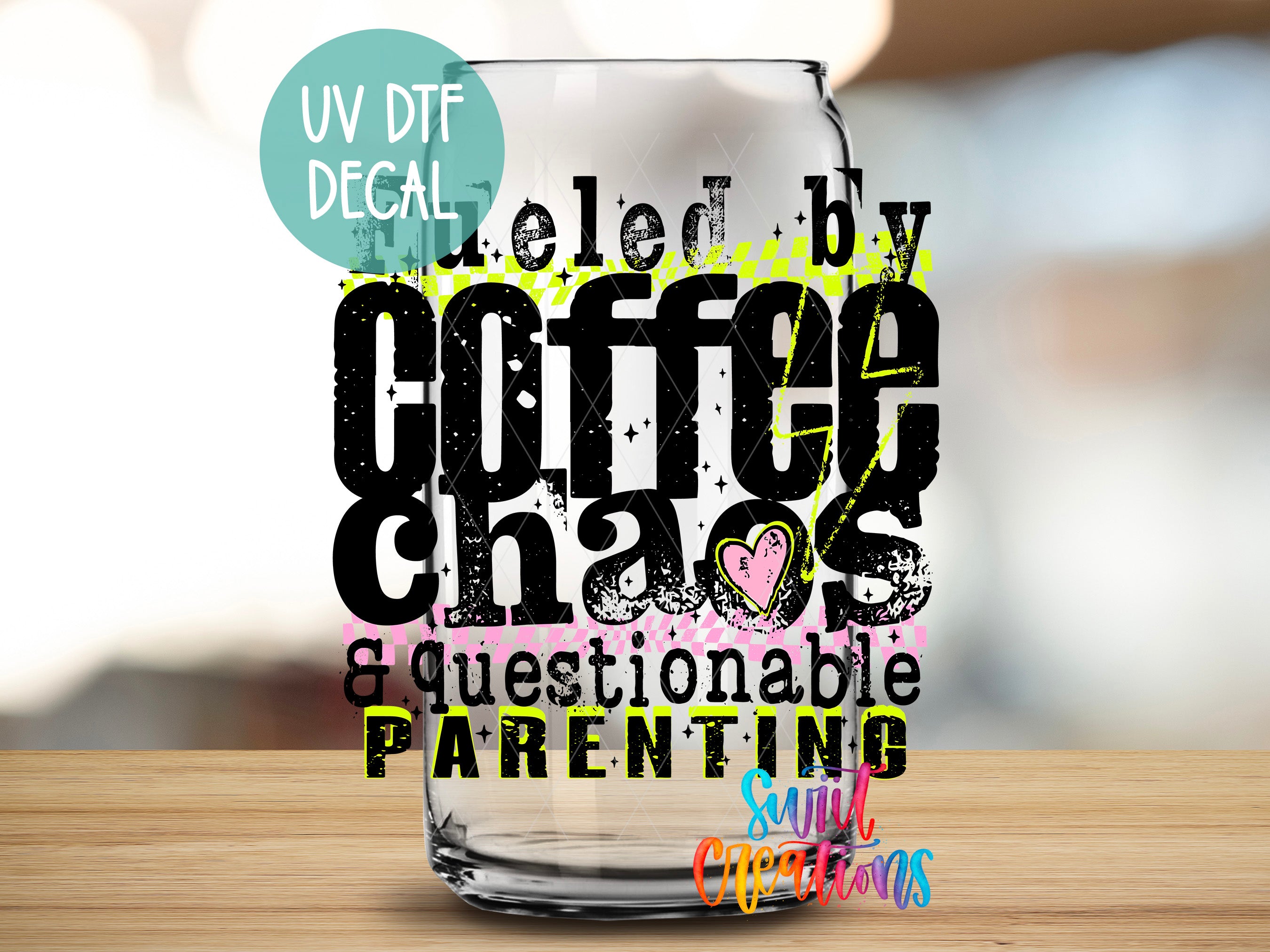 a glass jar with a text design on it, which appears to be a creative and playful representation of the phrase "Coffee Chaos & Questionable Parenting".