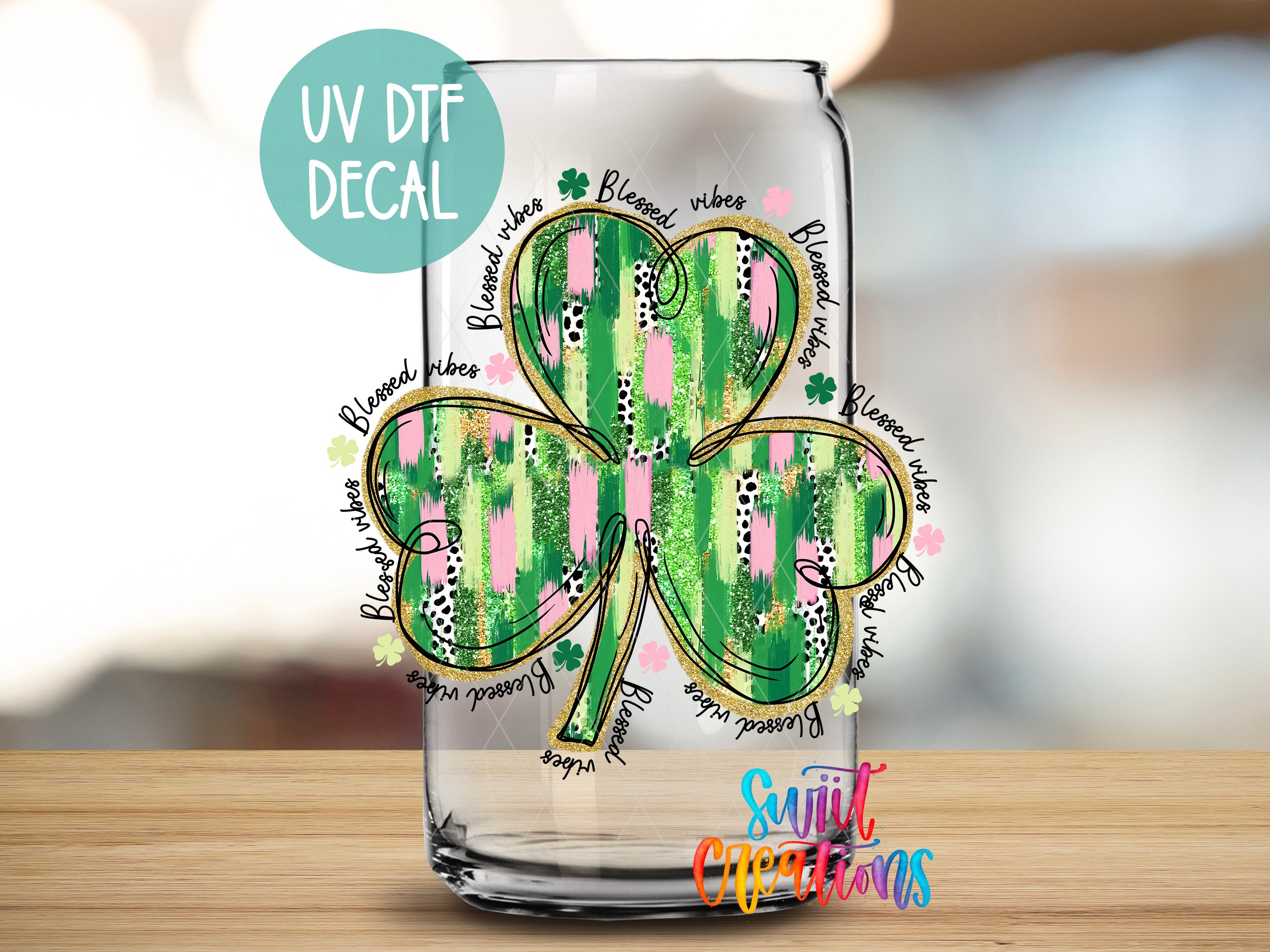 a glass with a four leaf clover on it