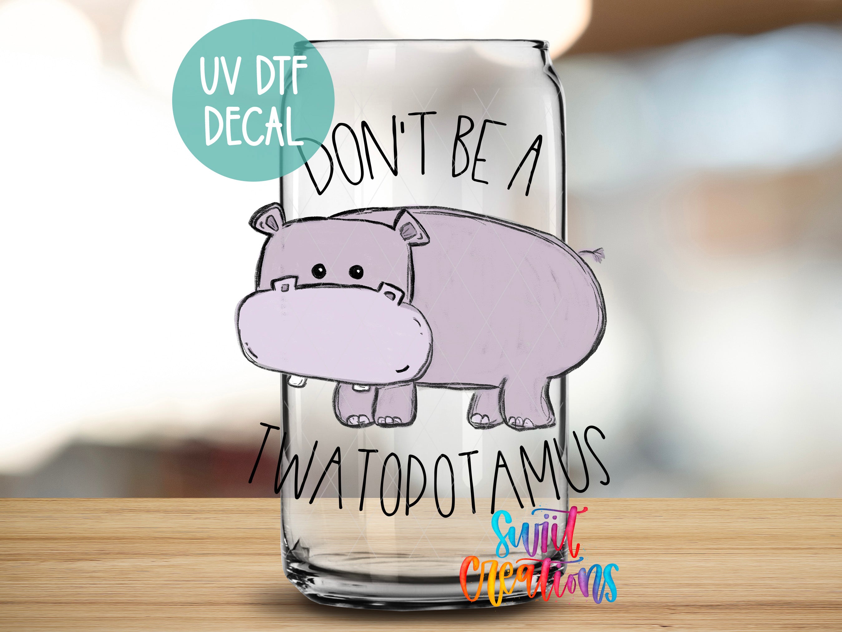 a glass with a hippo drawn on it