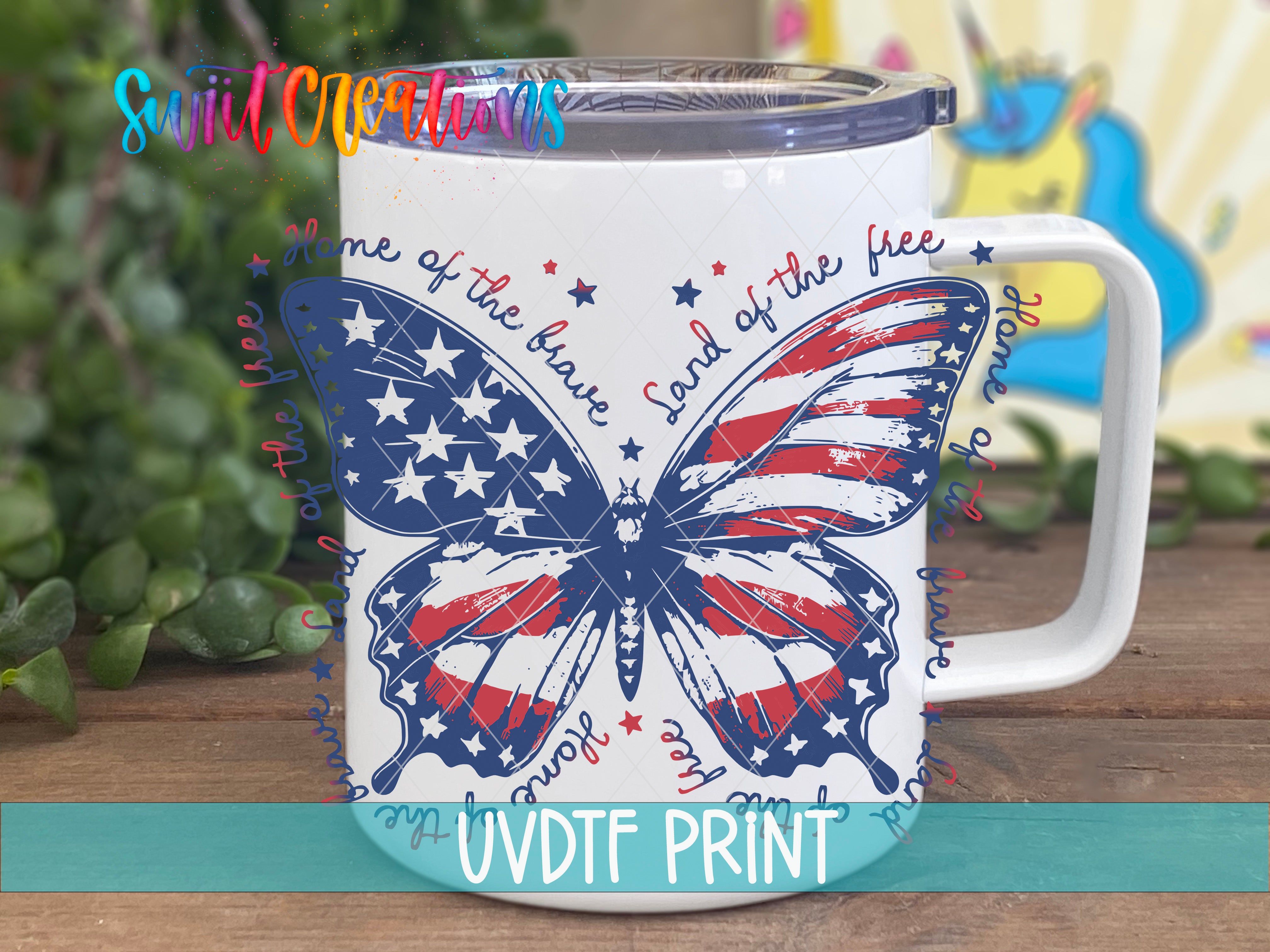 A white mug with a butterfly design and an American flag pattern, featuring the text "Home of the Brave" and "Land of the Free" written around the butterfly.