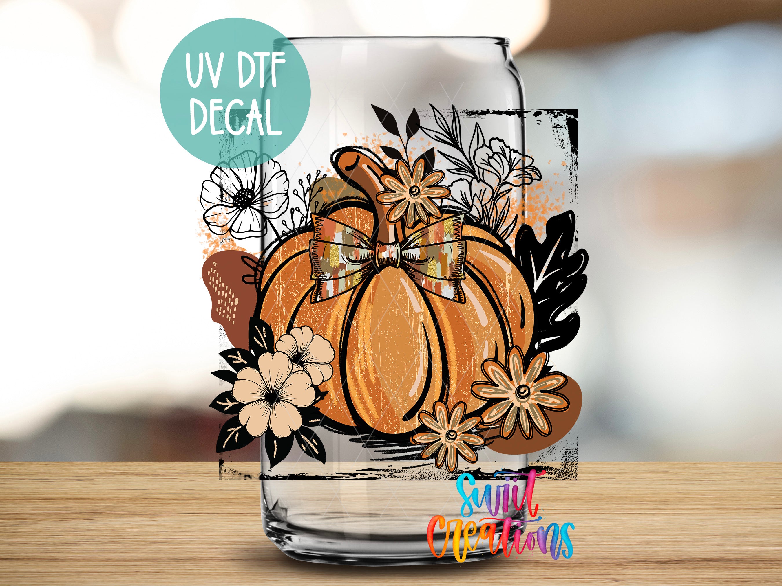 a glass jar with a pumpkin and flowers on it, along with a UV decal.
