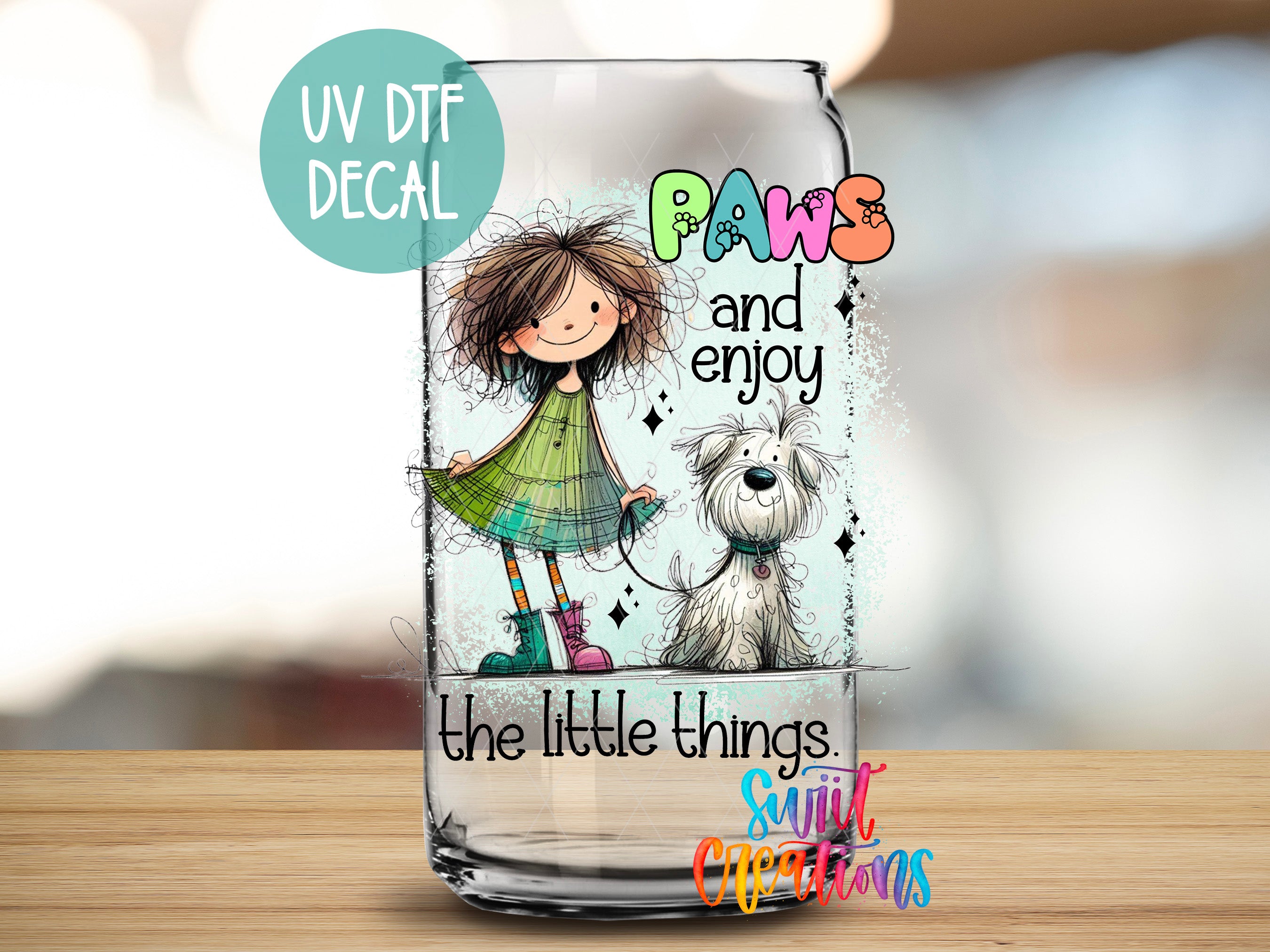 A glass jar with a cartoon illustration of a girl and a dog, along with the text "UV Dtf DECAL Paws and enjoy" and "The little things. Sunlit Creations" printed on it.