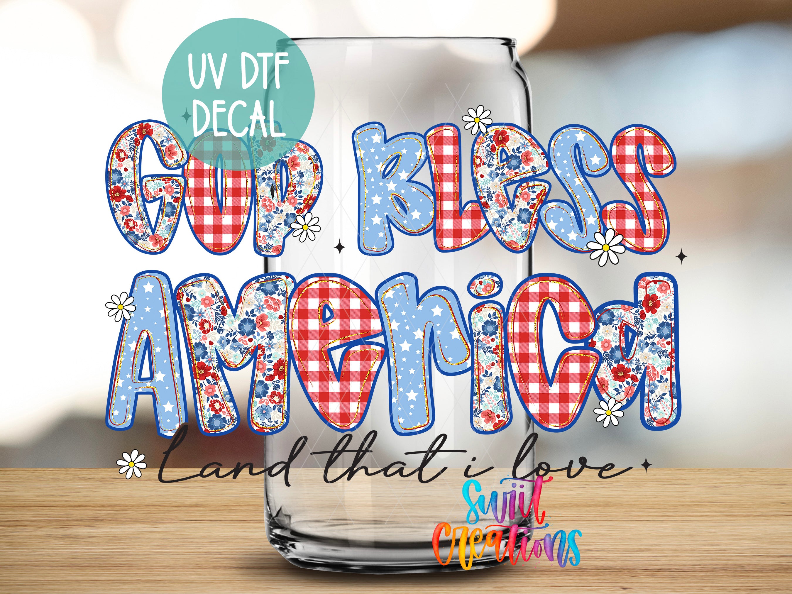 a glass with a decorative text design on it, which includes the words "Gup Kless America" and "Land that I love" along with various patriotic symbols such as stars and flowers.