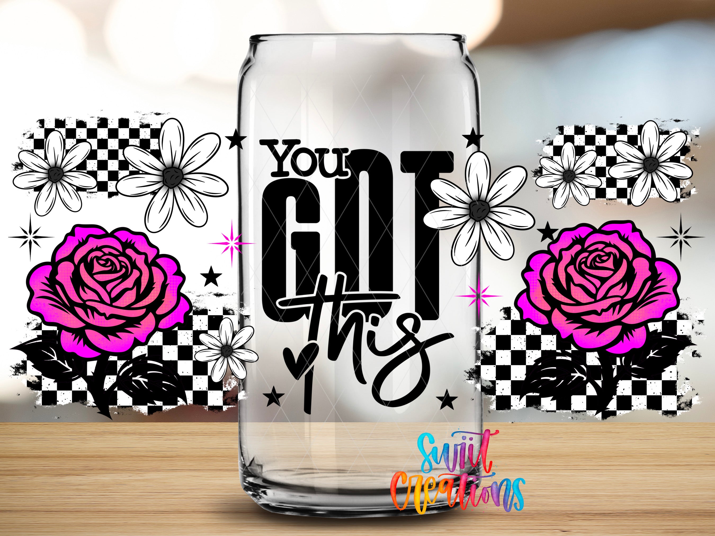 A glass can with the text "YOU GOT THIS" printed on it, surrounded by floral designs and stars.