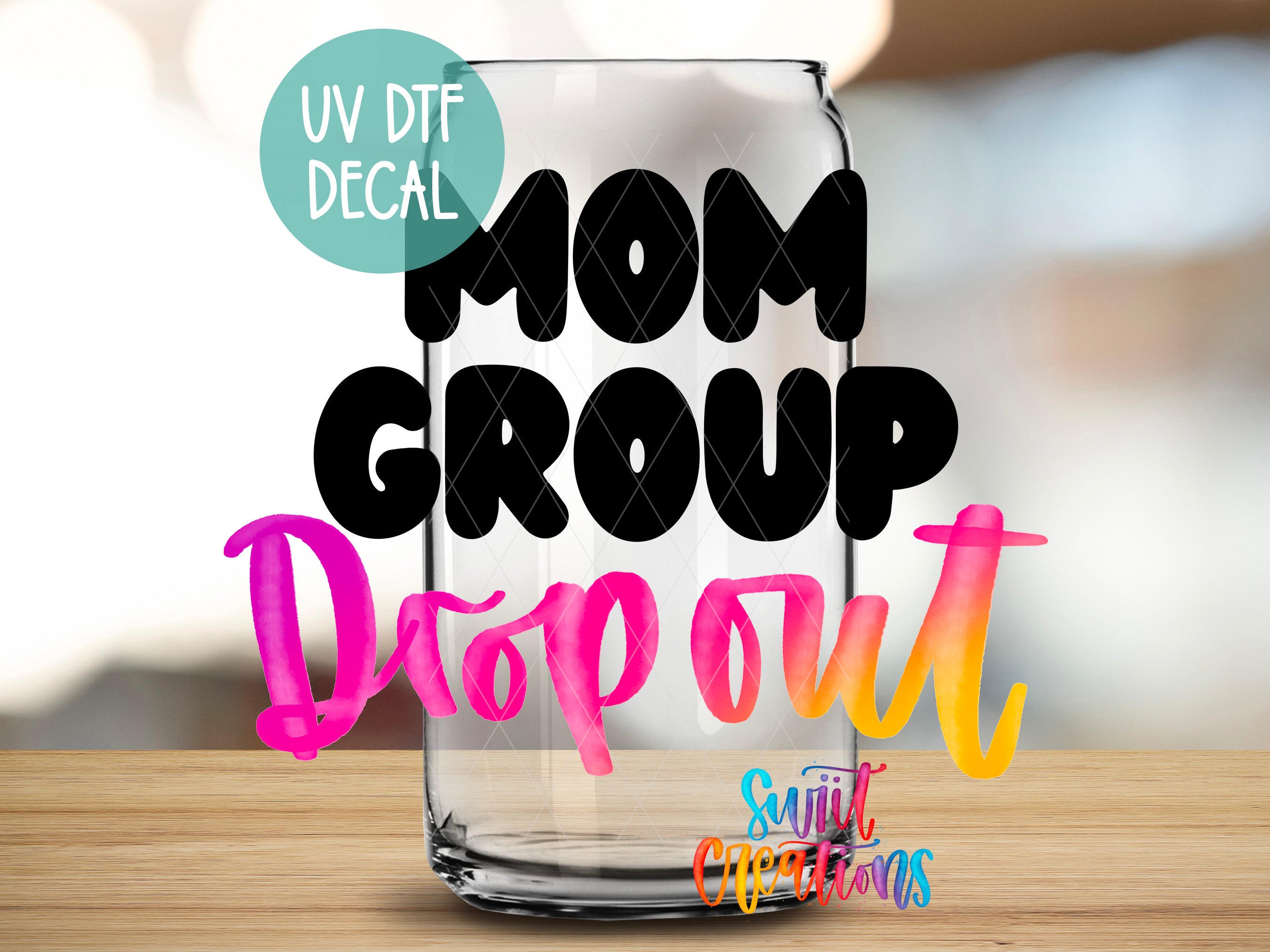 a glass can with the text "MOM GROUP Dropout" written on it, along with a UV decal that says "UV Dtf Decal".
