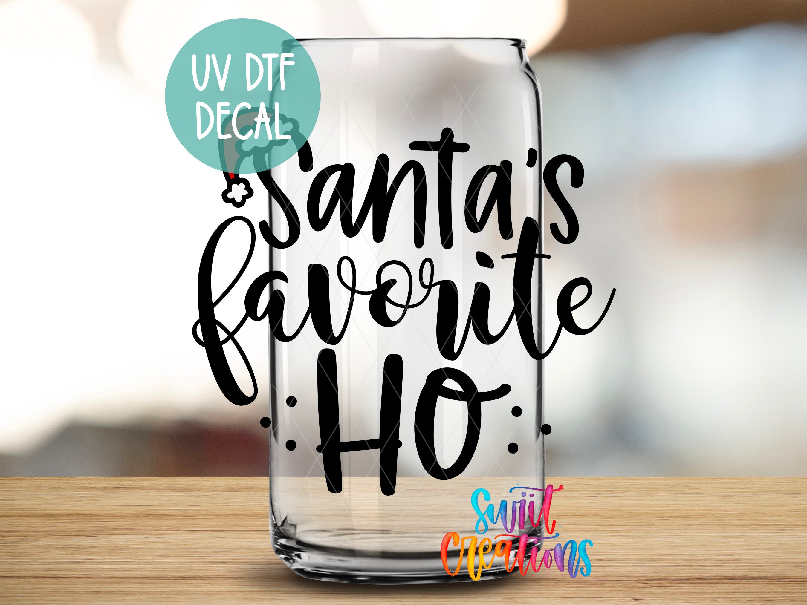 a glass with the words santa's favorite ho written on it