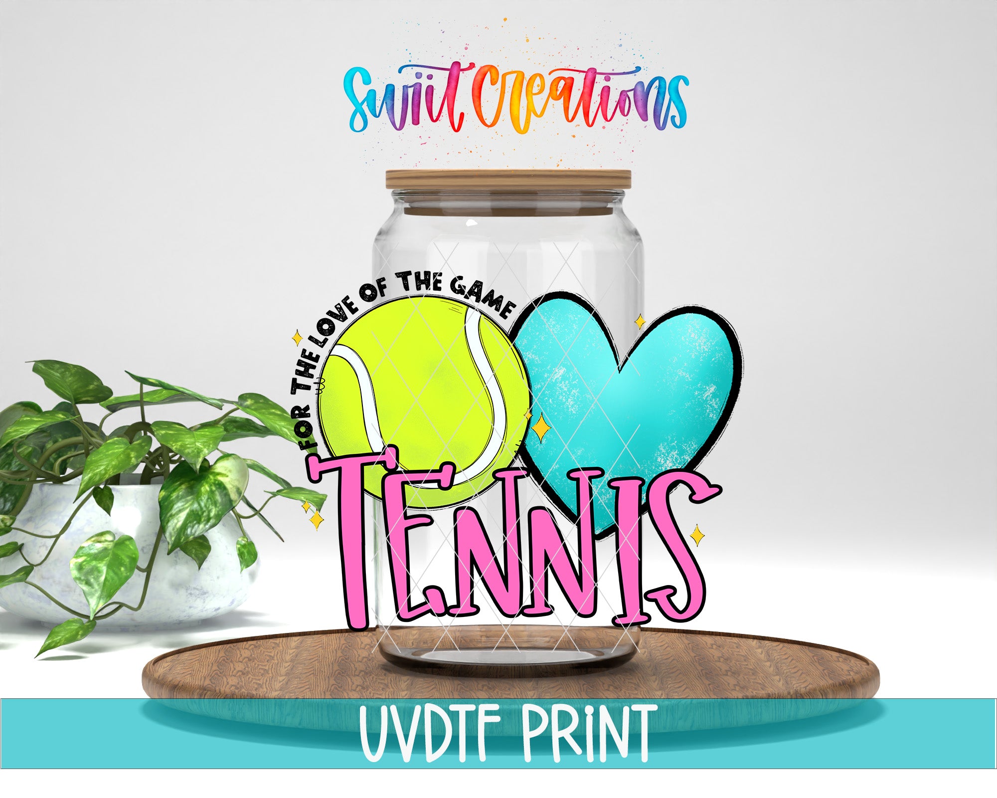 A glass jar with a tennis ball inside, surrounded by a heart and the word "Tennis" written on it. The jar is placed on a wooden surface, and there is a plant in the background.