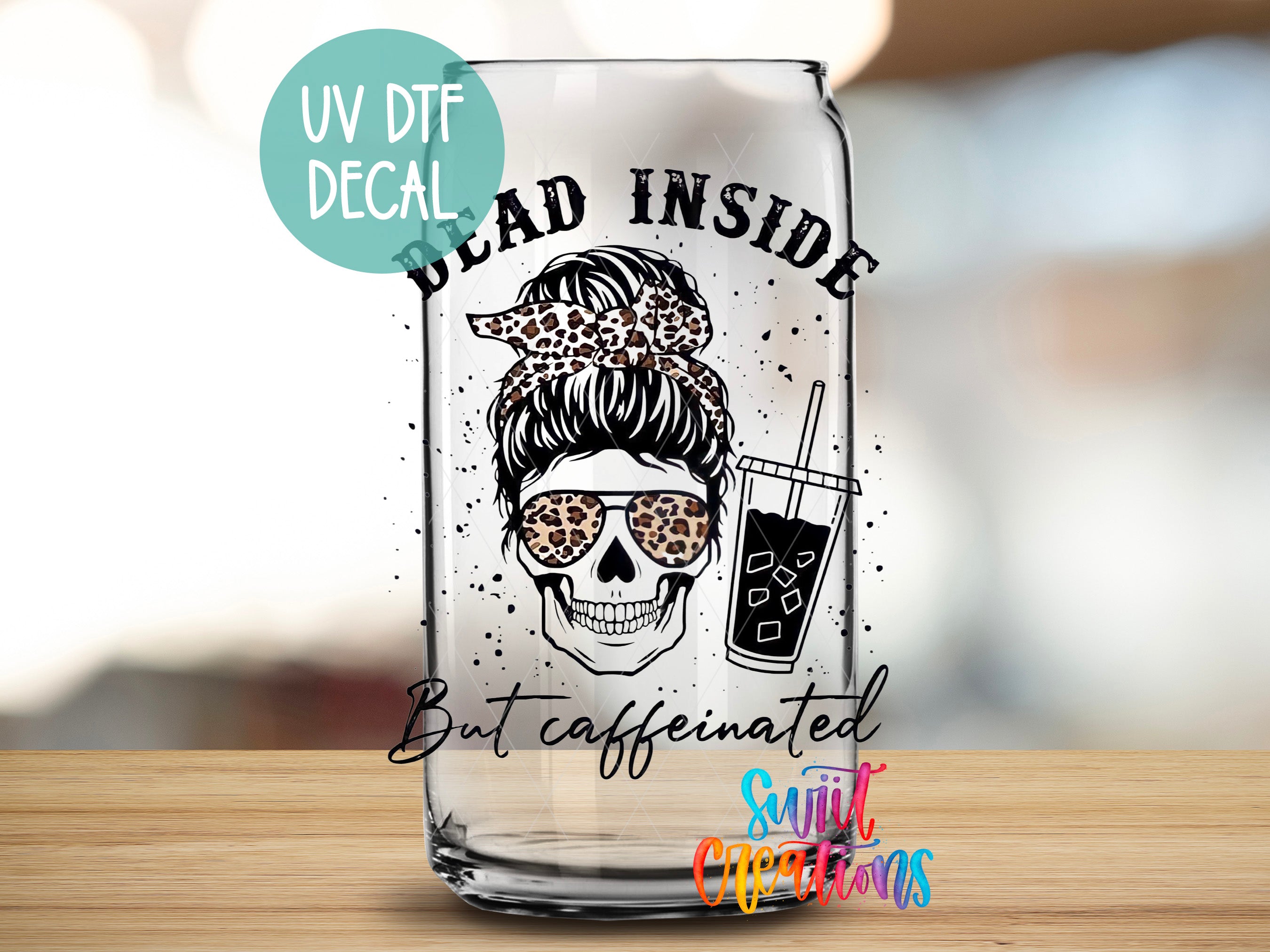 a glass with a picture of a woman with a skull on it